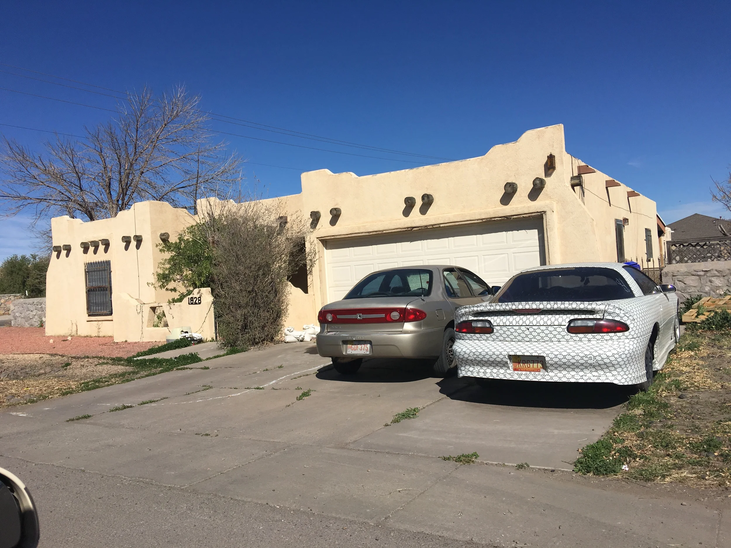 This is what an average Southwestern home looks like; quite a contrast to New England! Love the paint job on the car.
