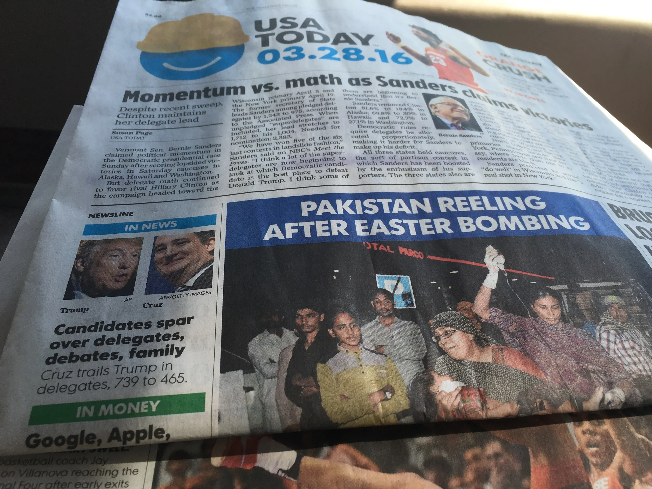 The engine and road noise is loud; the radio has static; no CD player.....so I'm reading the newspaper to Russell.
