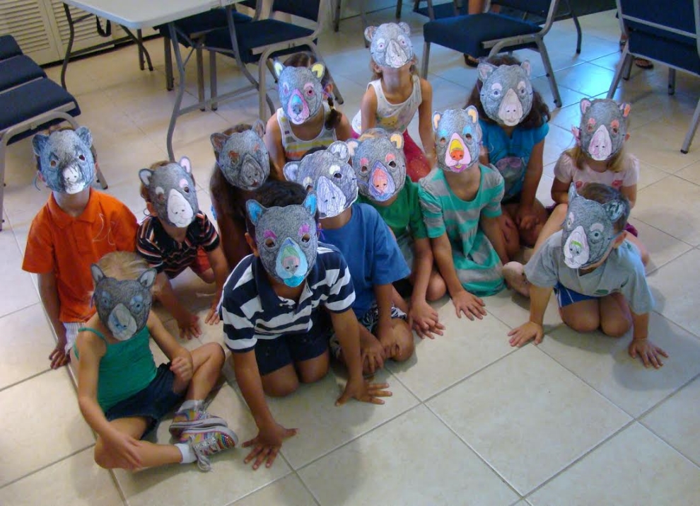 Students wearing bear masks that they created during a lesson on Florida black bear ecology and conservation (photograph by GLH)