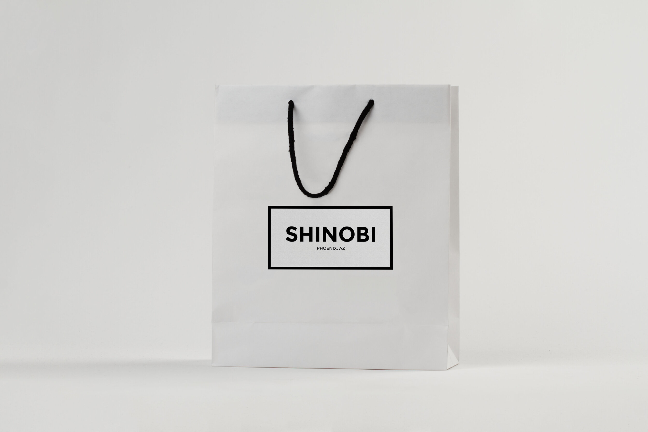 Shinobi White Retail Bag Black String.jpg
