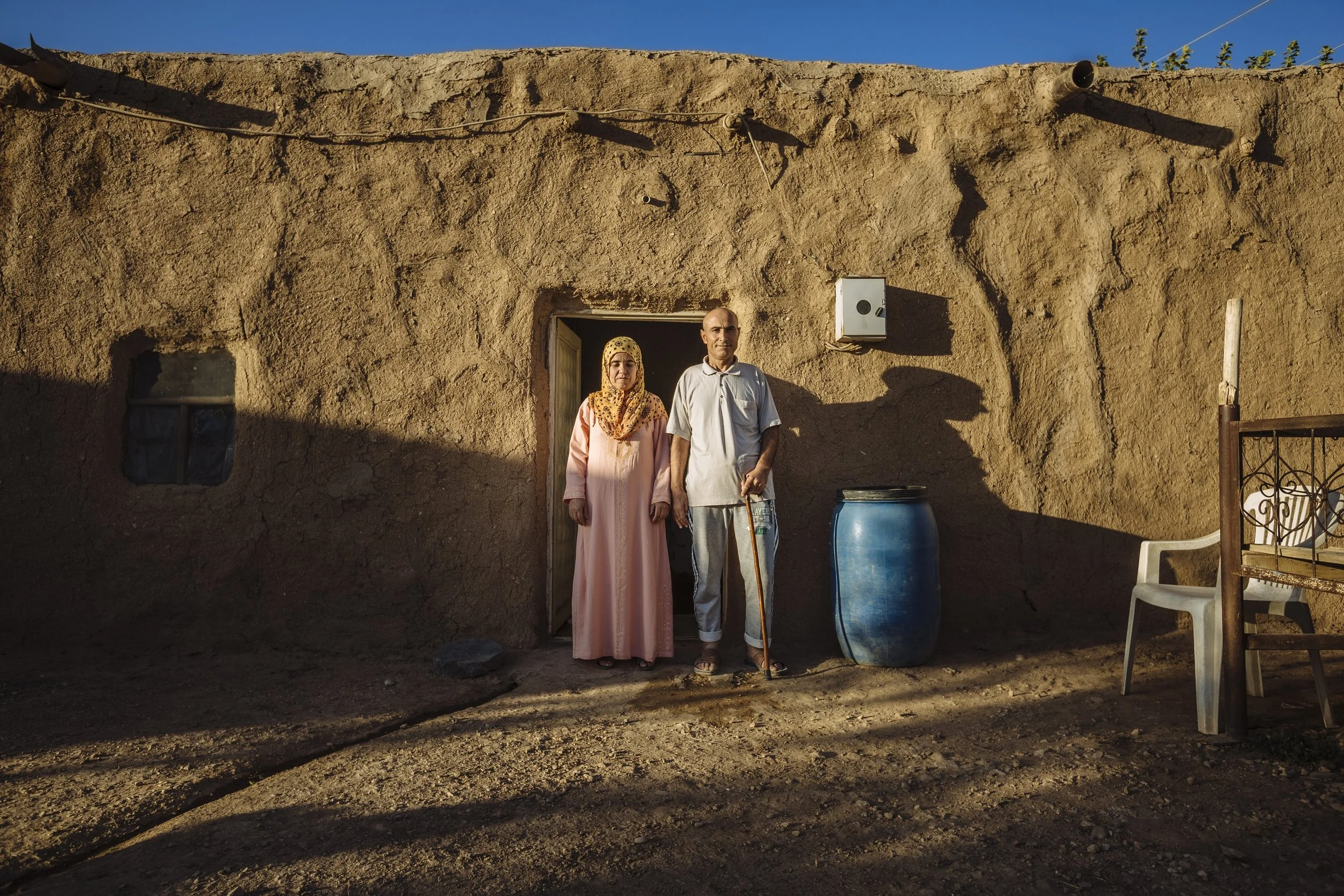Ahmed and his wife, Ismah, live in a mud house straddling the border with Syria near their hometown of Kobane. The mud house has been their home since fleeing to Turkey two years ago, when they came across it. The mud helps the house remain cool during the summer months, and warm during the winter.