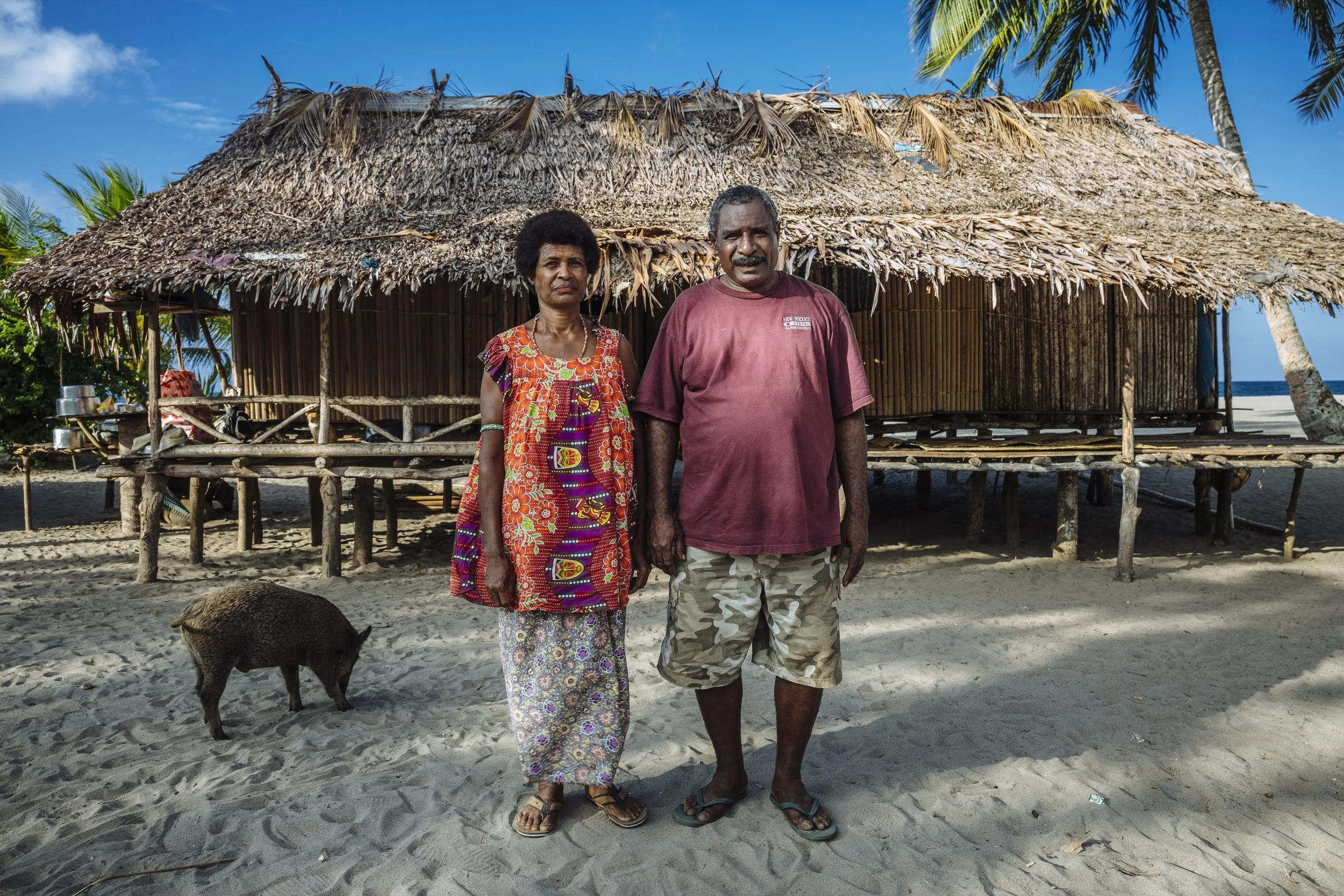 Mike and Alice are villagers from Killerton, Papua New Guinea, where they live in the house they built themselves several years ago. They were displaced from their village when a flood tore through it in 2007. Before the water could reach them, Mike and a few villagers managed to saw his home in half and move it out of the path of the deluge before repairing it again. They continue to live in the same house.