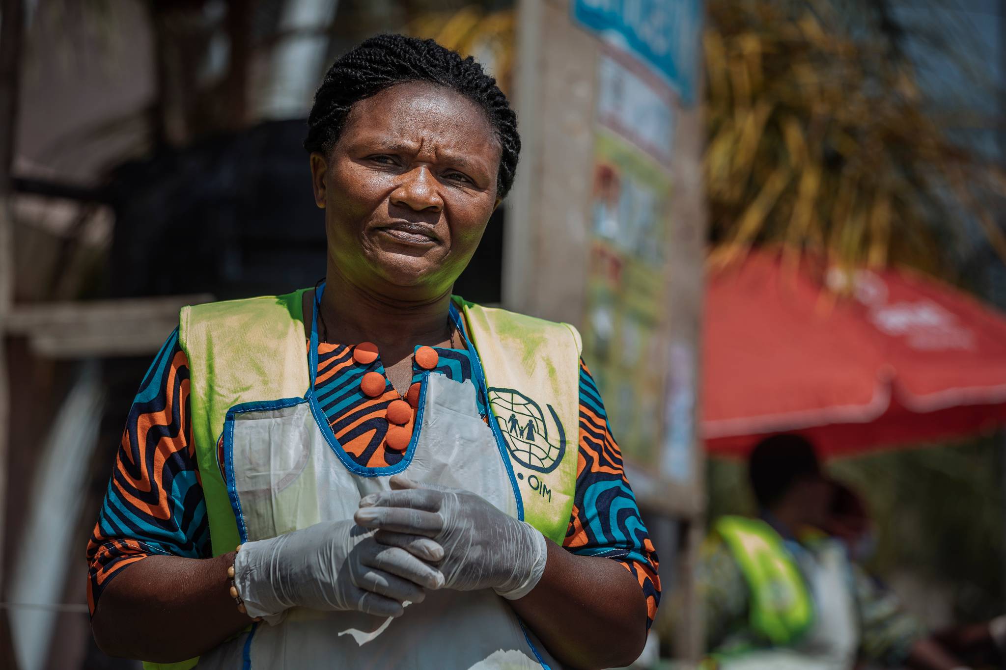 Bita Bernadette observes travellers for symptoms of Ebola as they cross the Grande Barriere point of entry in Goma, the second main gateway linking the DRC and Rwanda. Front line workers like Bernadette help curb the spread of the virus at health sc