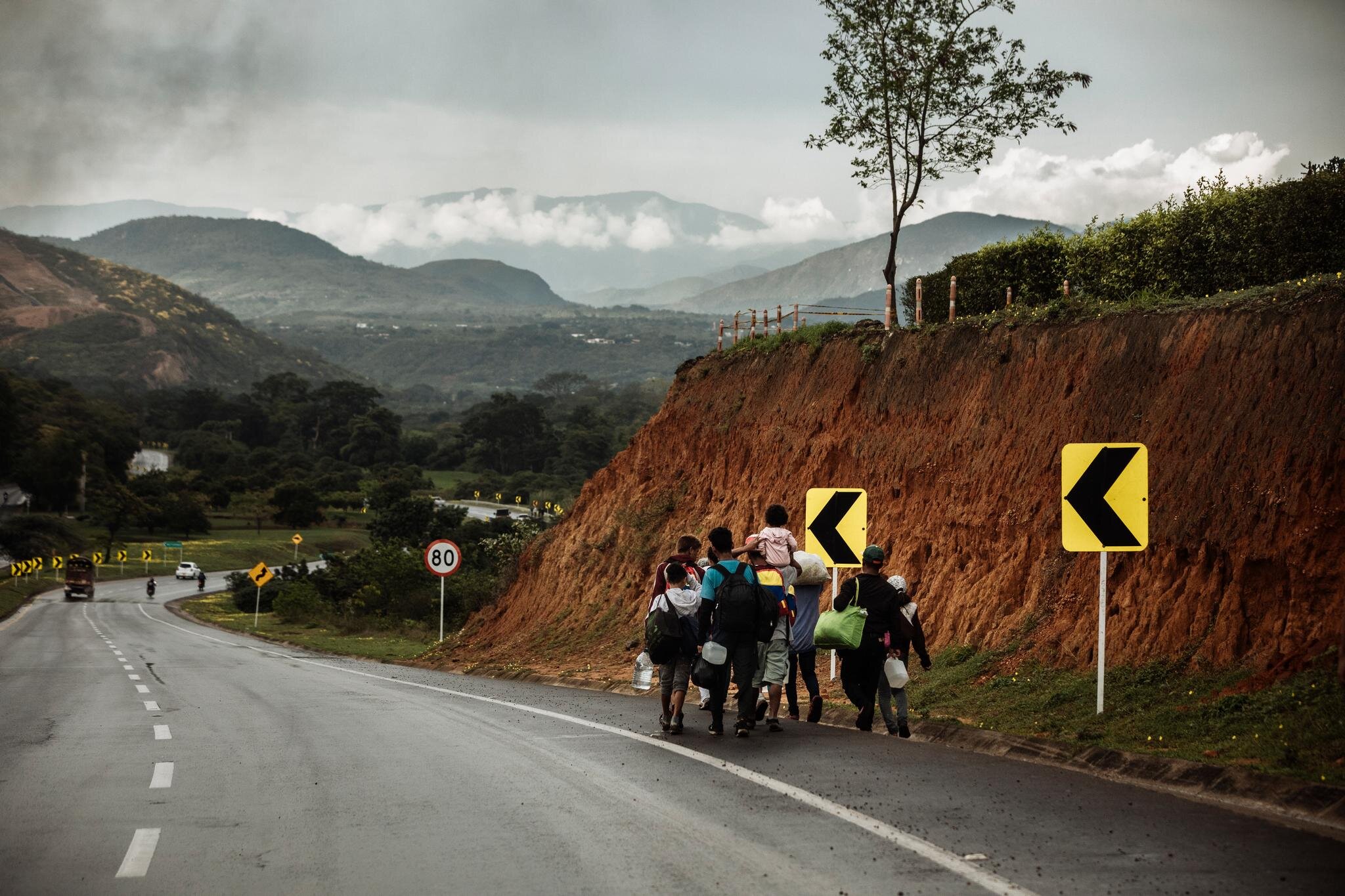 Venezuelans walk along the side of the road from the Colombian border town of Cucuta toward Pamplona, one of the first major cities along the migration route to the capital, Bogota. Healthy and able-bodied travellers usually complete the 75 kilometr