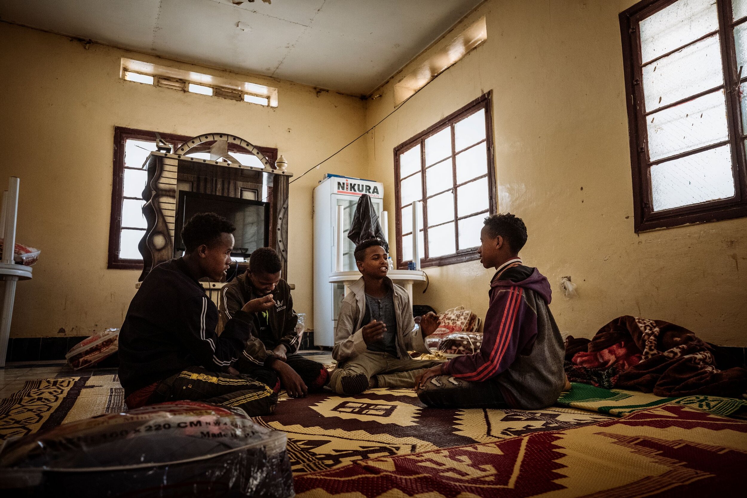 Children abandoned by smugglers gather at a community centre for Ethiopian migrants in Hargeisa, Somaliland. The young boys were strangers to one another but shared the same journey - and the same fears. Lured from their rural homes with the promise