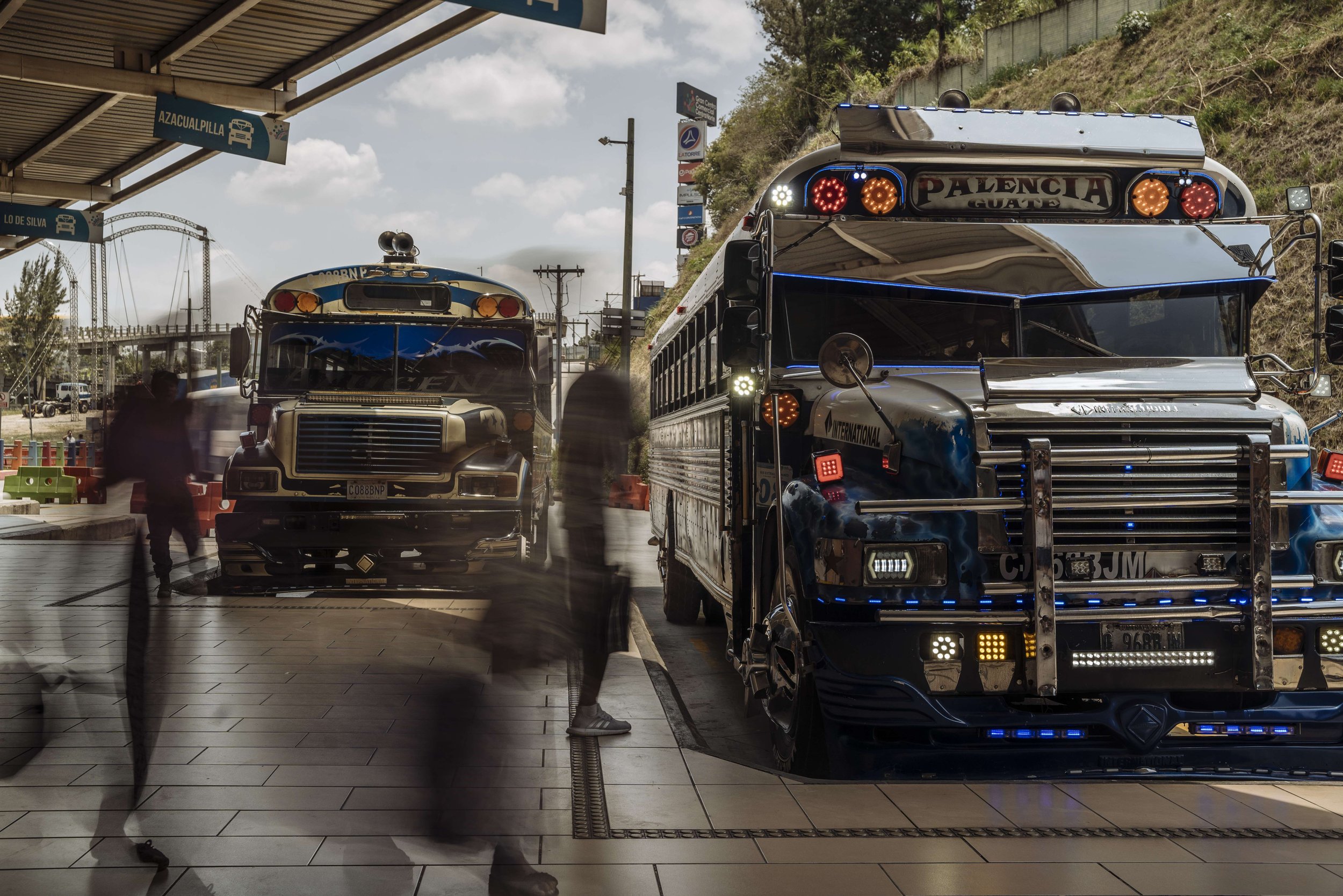 Migrants board buses at the bus station located in a mall in Guatemala City. The bus station serves as a transit point for several migrants who have been travelling through the country.