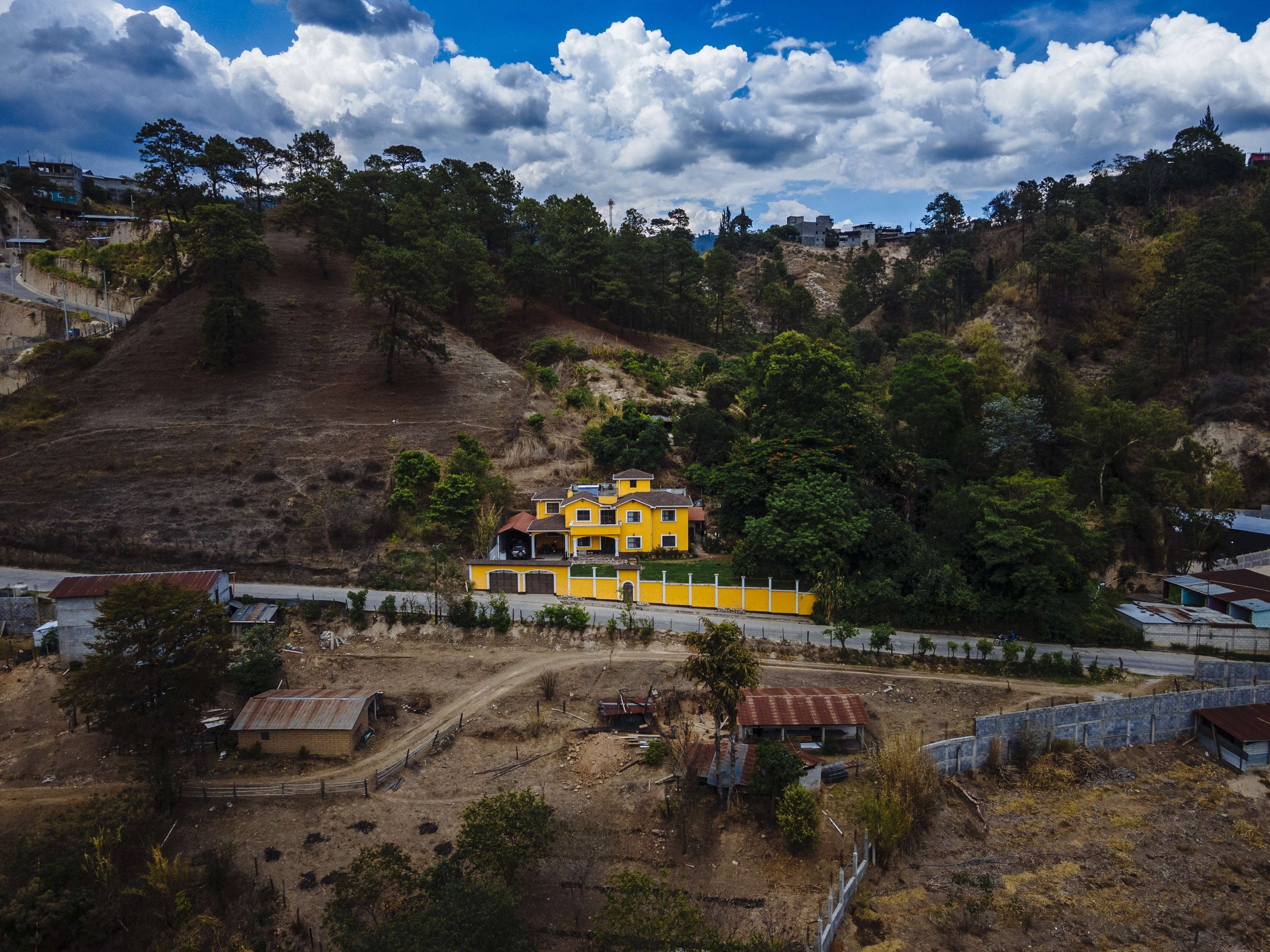 Across the country, there are several large, well-built homes that stand out in the neighborhood. They are known locally as “remittance houses” and are largely funded by contributions from relatives who have traveled irregularly north to work. On t