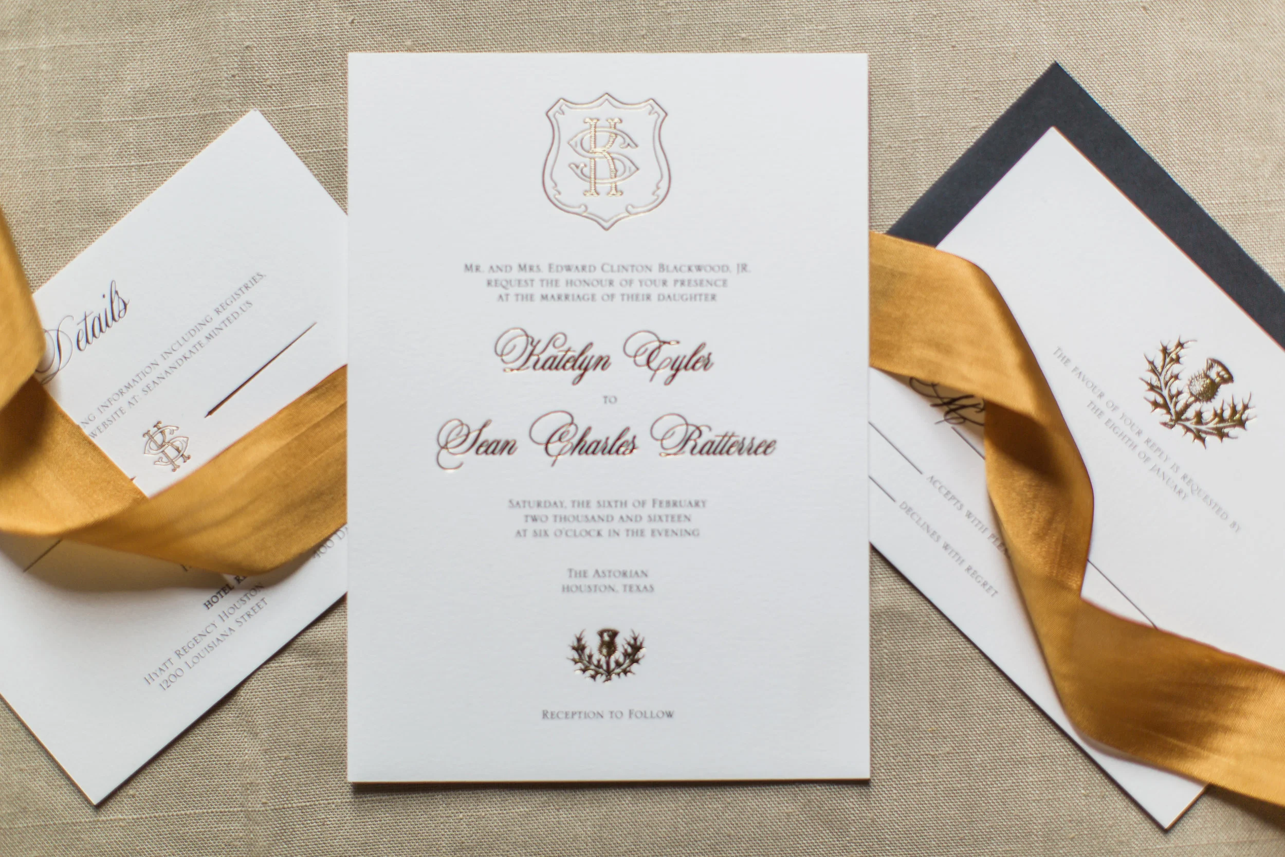 The custom crest, names and thistle were all foiled in this stunning suite. Photo by Lindsey Larue Photography