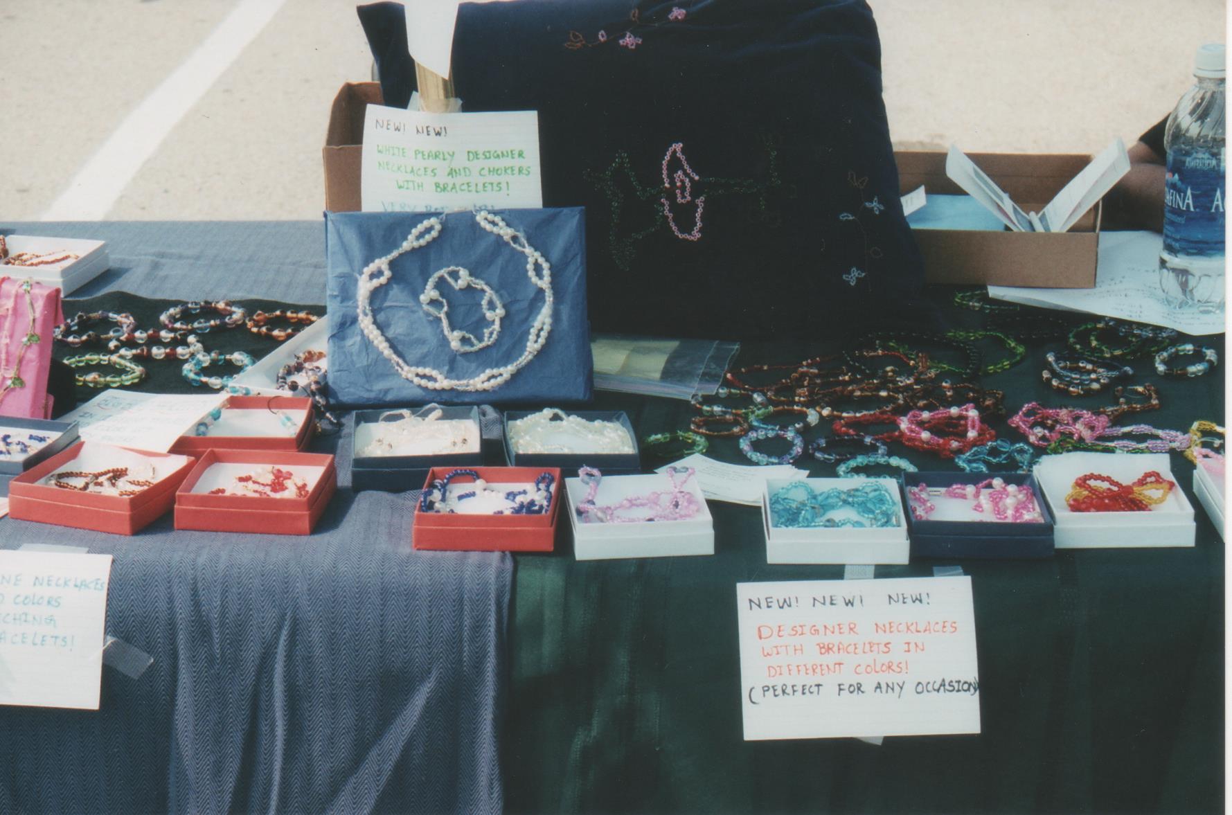 During this show I didn't even have the display stands necklace stands etc. So I just spread around the table all the jewelry. We brought the boxes and kept them open with jewelry inside. We also took photo frames and wrapped color paper and put jewelry on them. I did many shows with just seed bead and glass bead jewelry only but with different designs. I haven't learned anywhere but slowly self taught the professional way of doing with jewelry equipment.