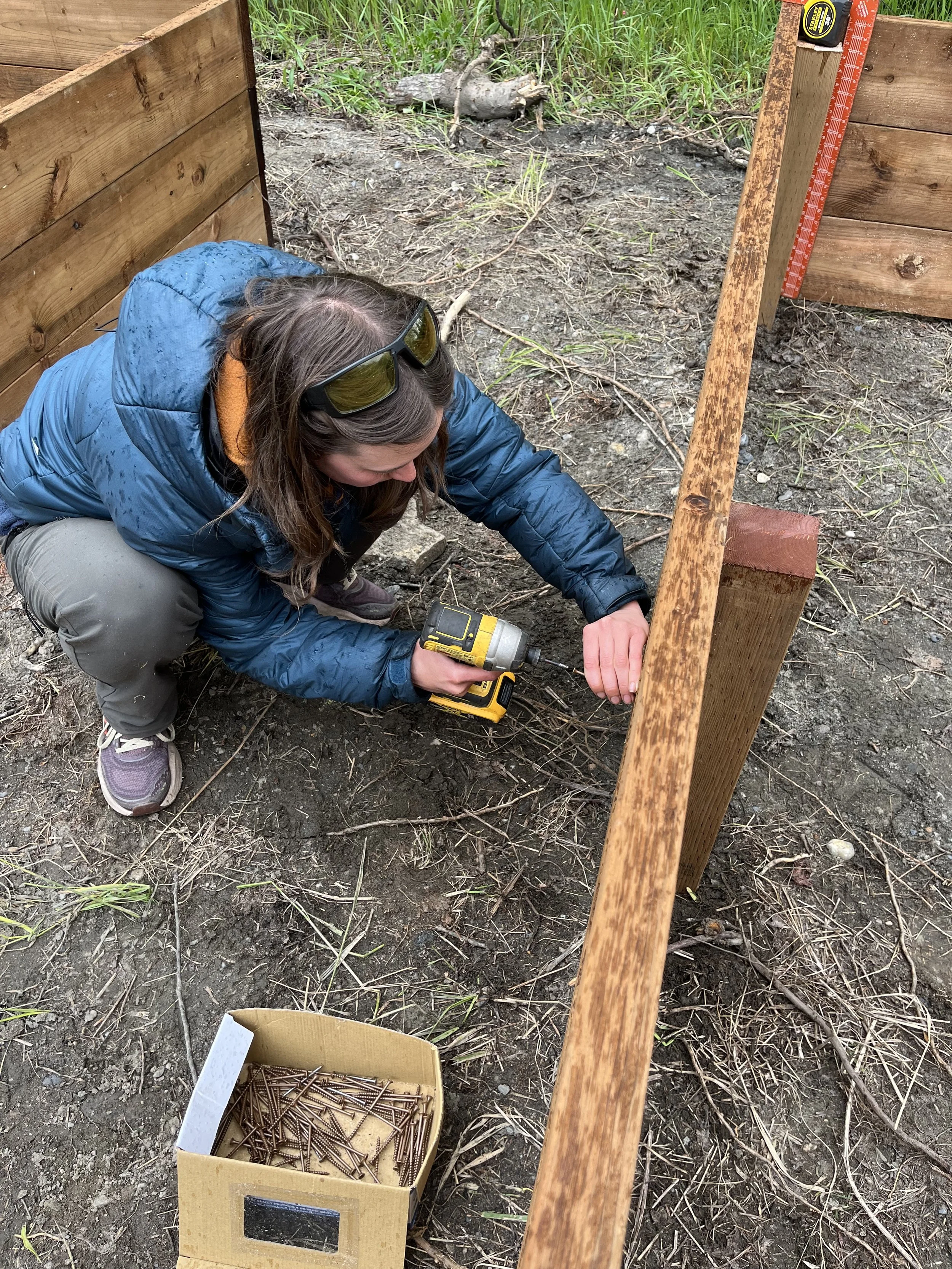 Volunteers constructing community garden beds
