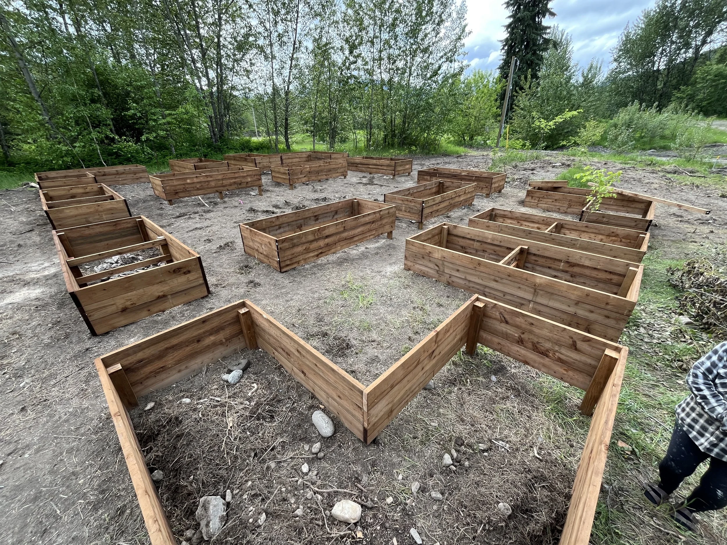 Volunteers helped us construct 16 raised beds for community gardening in May 2025.
