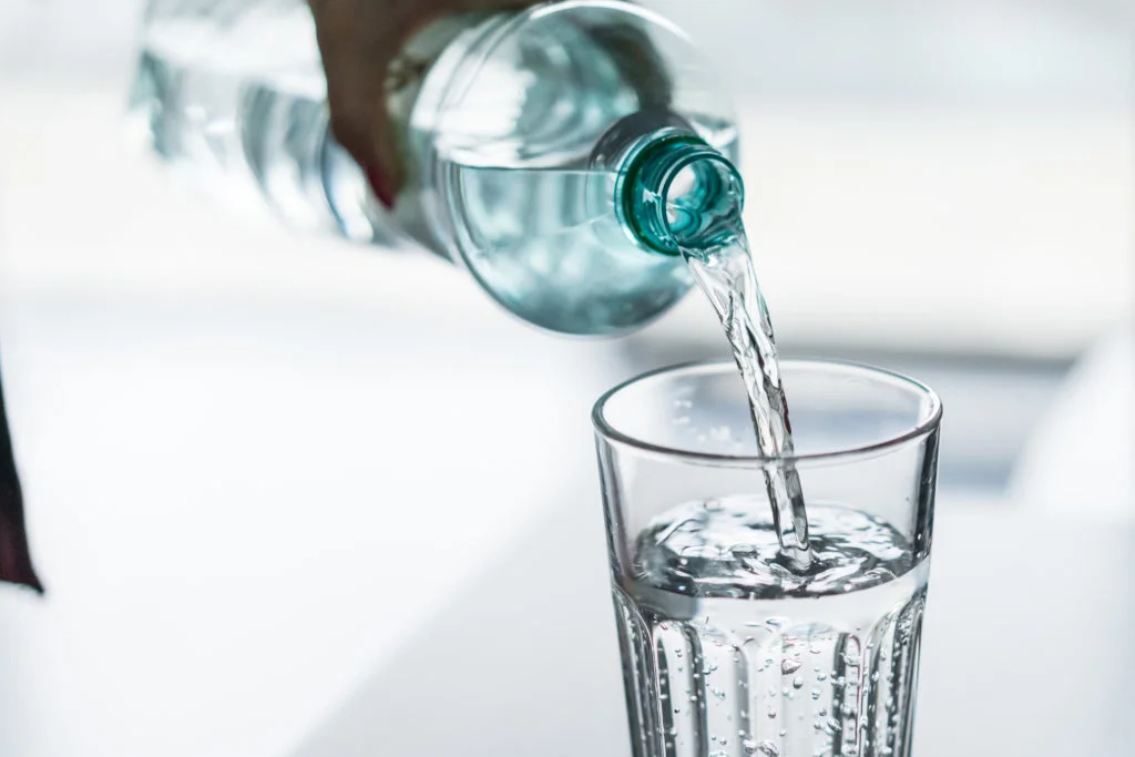 pouring-water-from-pet-bottle-into-a-glass-picjumbo-com-1024x683.jpg