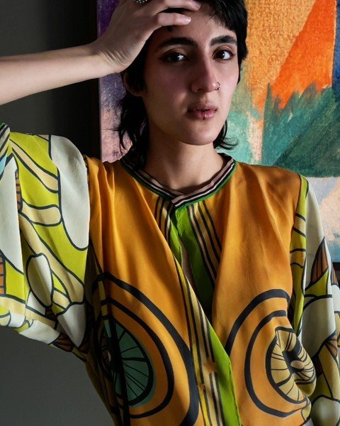 A one-of-a-kind wrap top, the result of experimenting with some slightly imperfect scarves.
All unique marks, blobs, streaks, and variations are the organic result of 
a handcrafted and sustainable process that transformed the original colours and pa