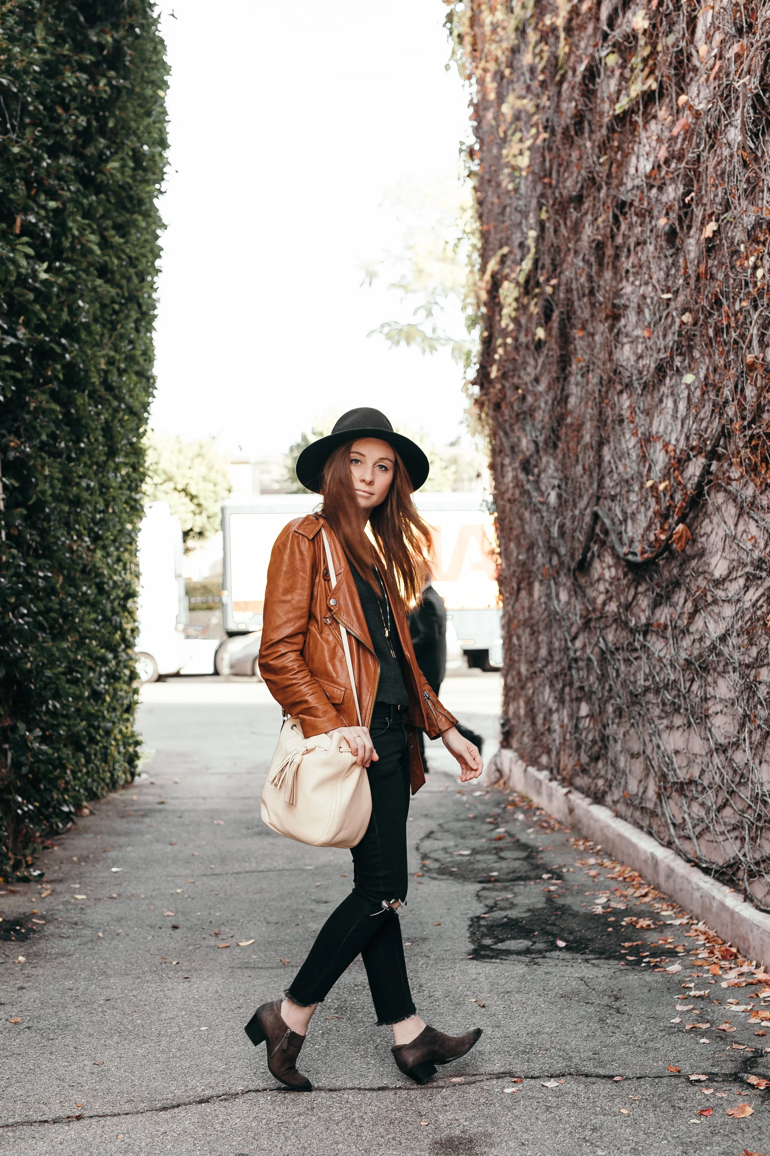 Hat: Rag and Bone , Jacket: 3.1 Phillip Lim , Top: Eileen Fisher , Necklace: Madewel l, Pants: Free People, Bag: J.Crew , Shoes: Franco Sarto . 