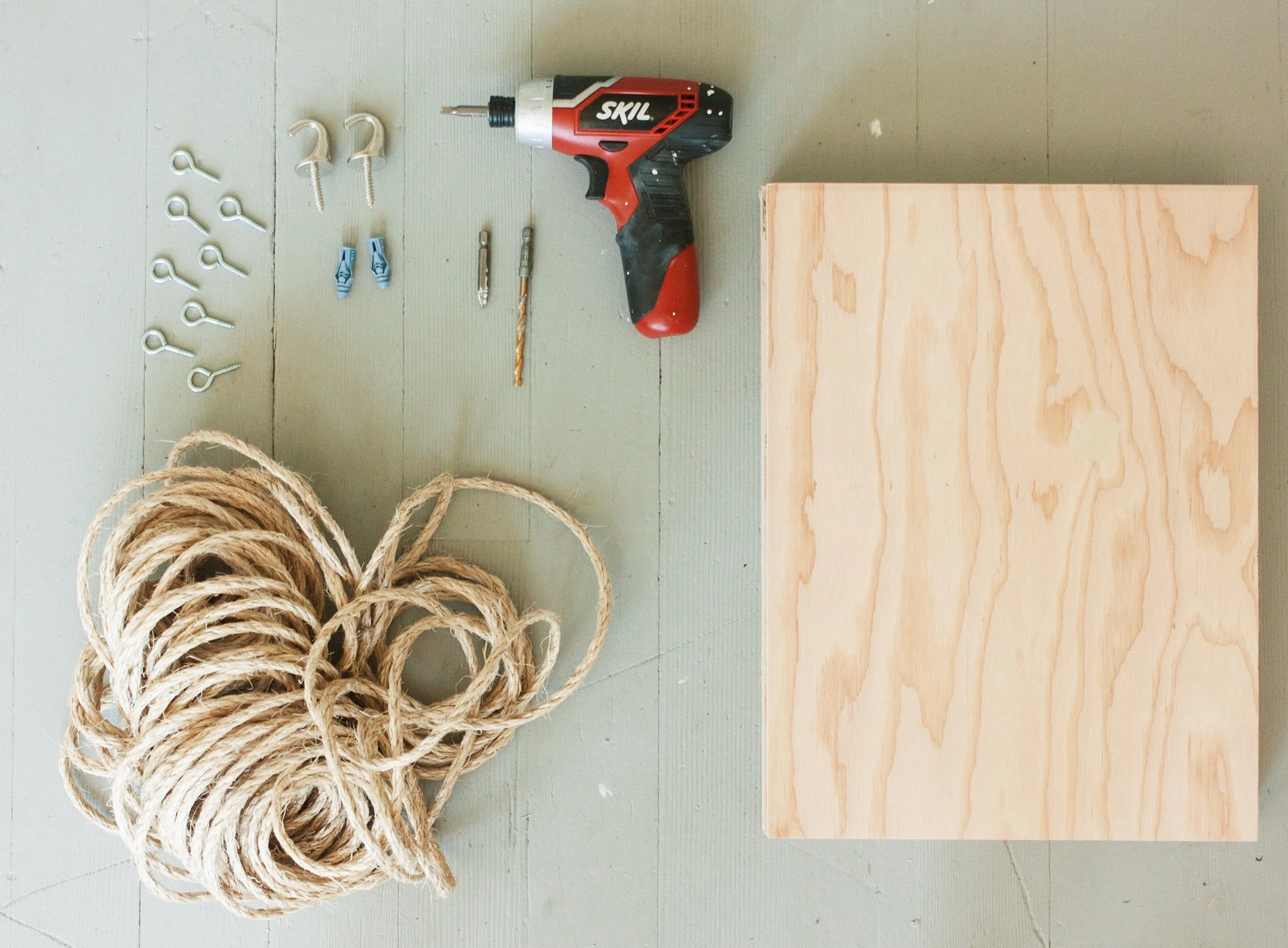 Super excited to post my first DIY project up here for you guys! I think I'm still trying to find my groove into what this blog section of my website is geared towards. We all know by now that I love traveling and photography but I also really love DYI projects and making things with my hands. Now that I just moved into my own home with a few friends, LOTS of home renovations have started to take place and will be continuing on for a while. I made these hanging shelves last week and got a lot of people asking how to make them. SO, I figured I would make a post about it! It's crazy east to make and I found all the supplies at Home Depot for pretty cheap. I think I spent no more than $40 and was able to make 6 shelves from that. Here are the supplies you will need: 1. 12x16 piece of wood (I had mine cute to those dimensions but you can cut them to any size you like.) 2. Power drill 3. measuring tape 4. Rope 5. Screw eyes (I got the #10s) 6. Ceiling hooks (Home Depot had a few different styles. I opted for the plain silver.)