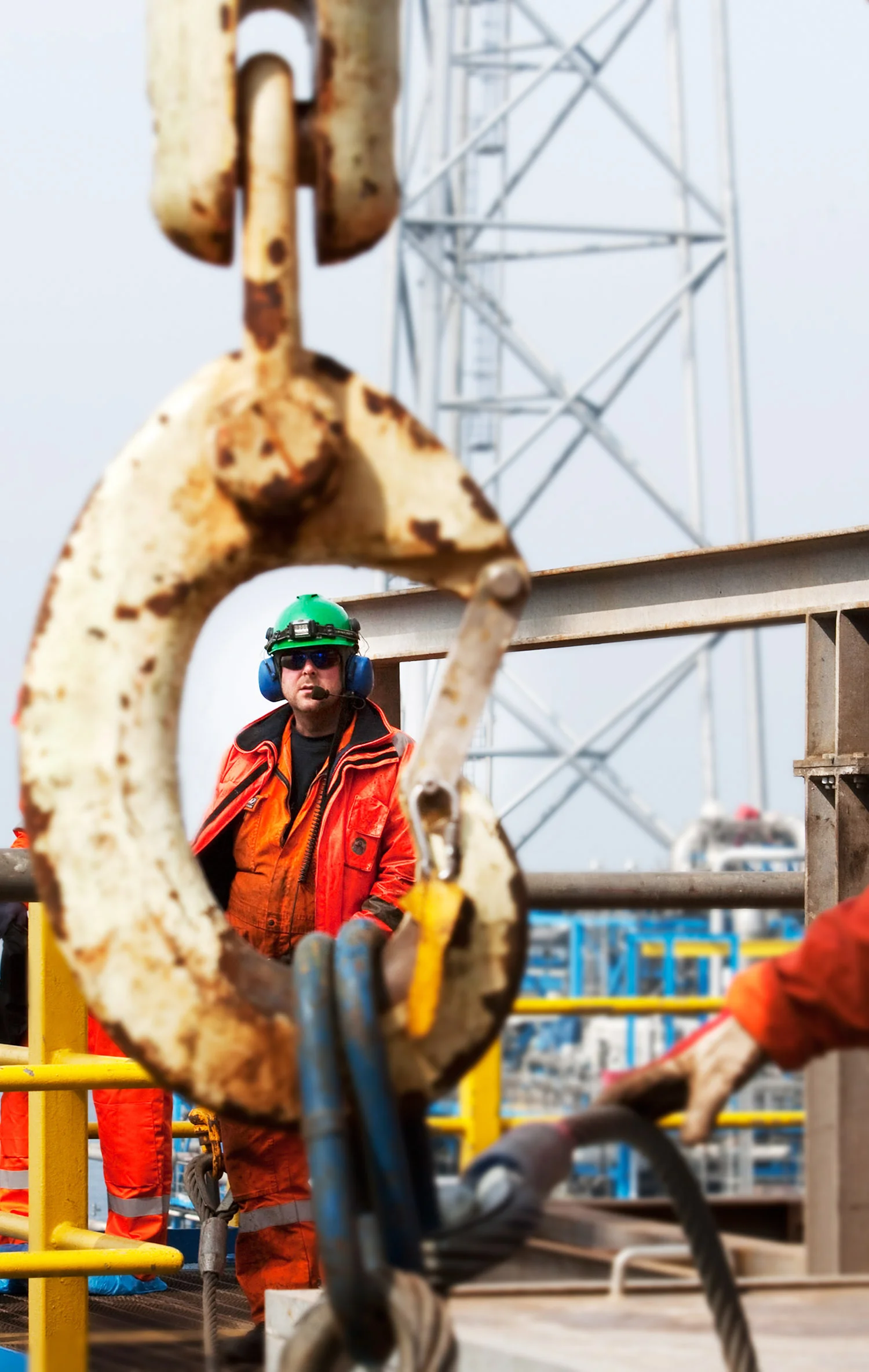 Workers are using a crane to lift heavy materials at the Sleipner gas and condensate (light oil) field in the North Sea 250km from the coast of Norway, on Friday, April 24, 2009. Sleipner became the world’s first offshore CO2 capture and storage plant when they started storing CO2 underground in 1996. Photographer: Heidi Wideroe/Bloomberg News