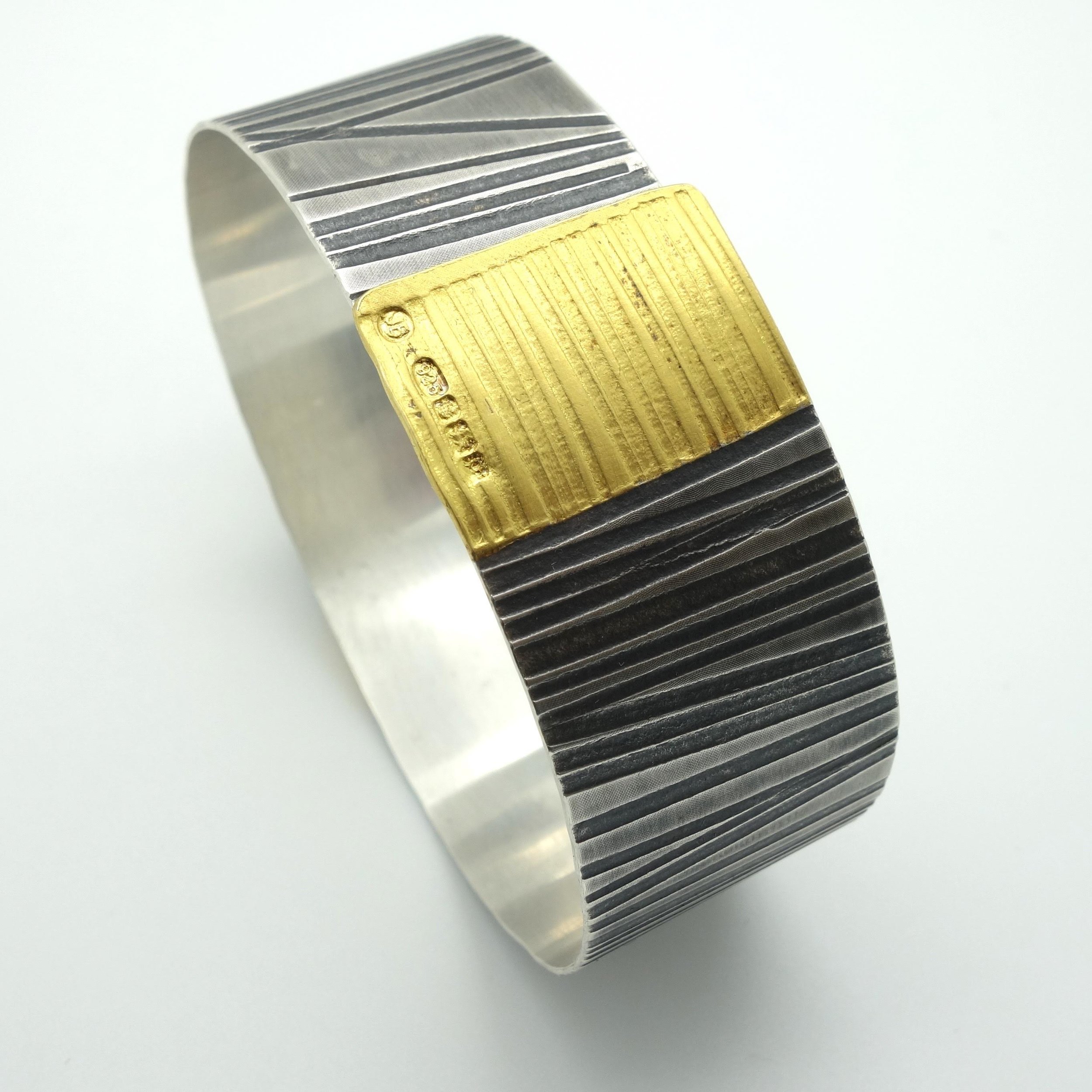  Cuff Oxidised silver and gold £ 