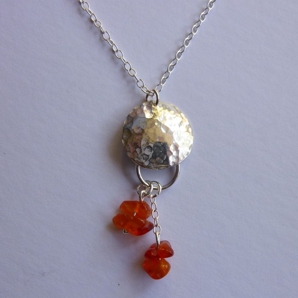 silver hammered domed disc necklace with carnelian drop