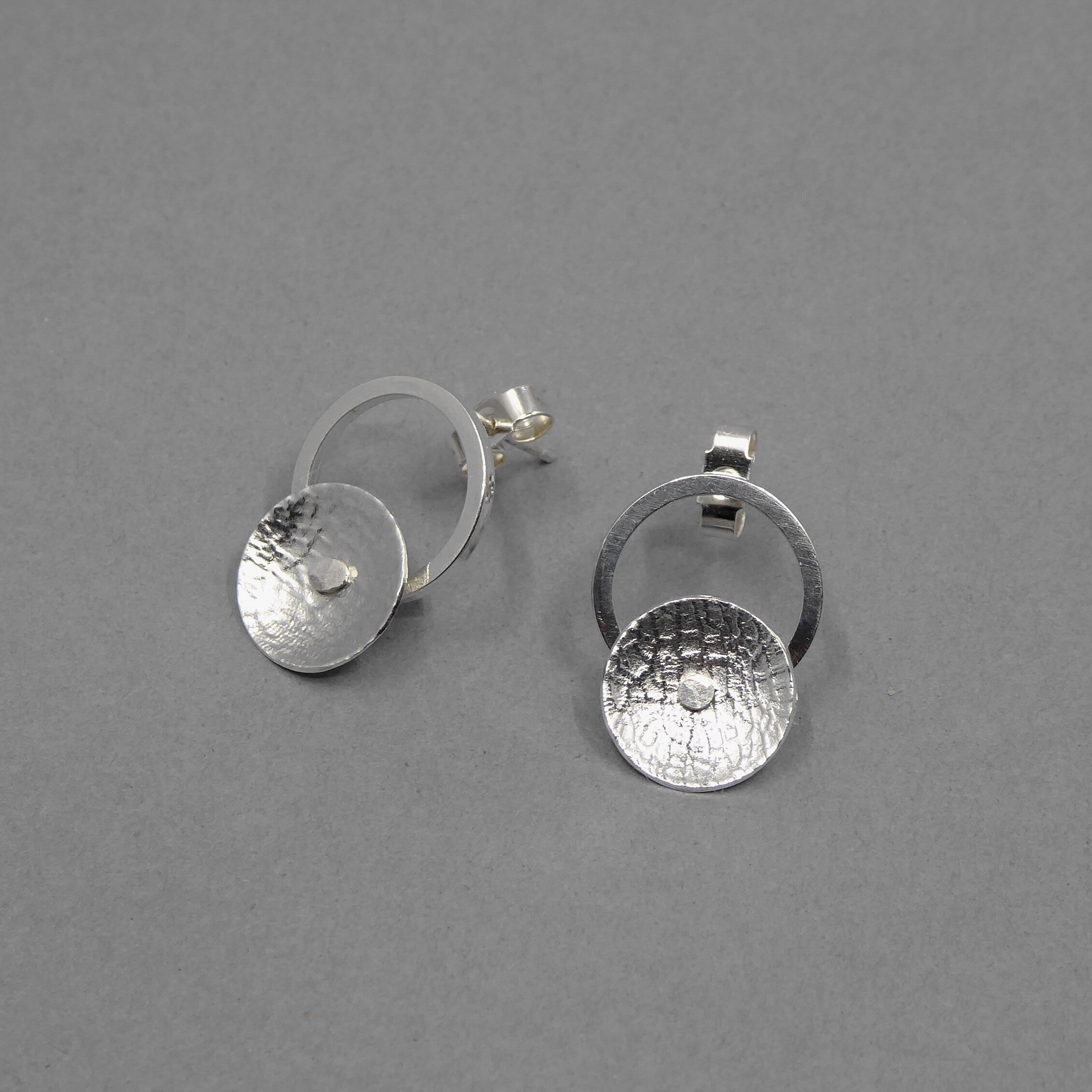 Silver and cup form stud earrings.jpg