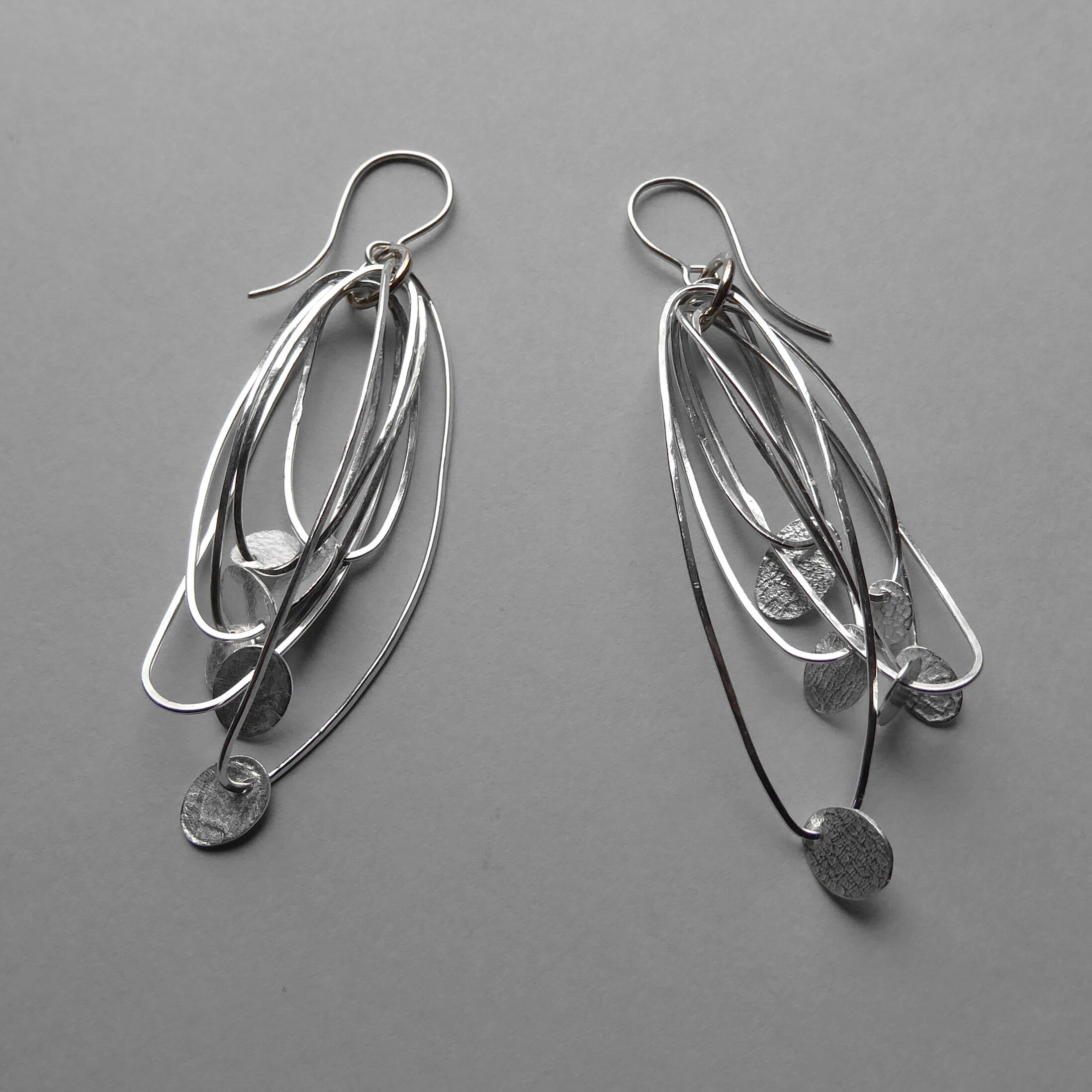 Silver floating wire earrings.jpg