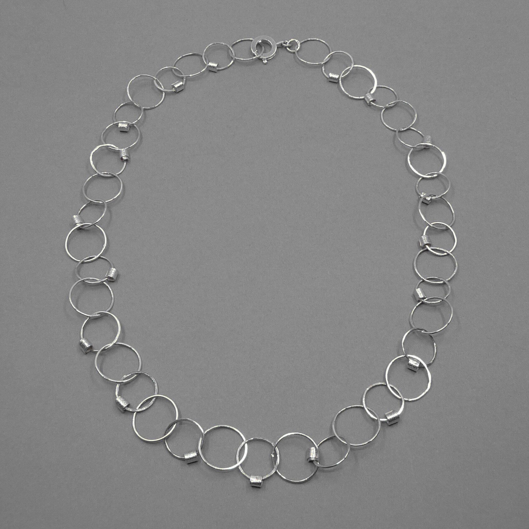 Silver handmade chain necklace with tiny scrolls.jpg