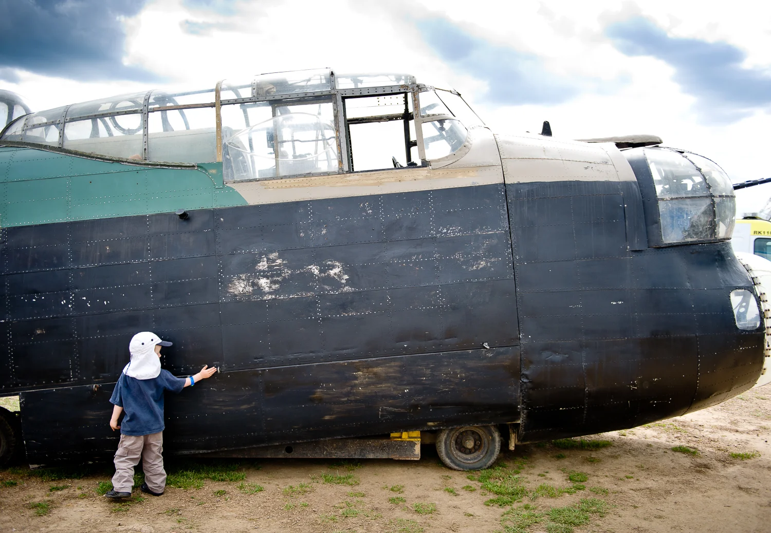 Boy admiring WW2 bomber, War and Peace Show, Kent