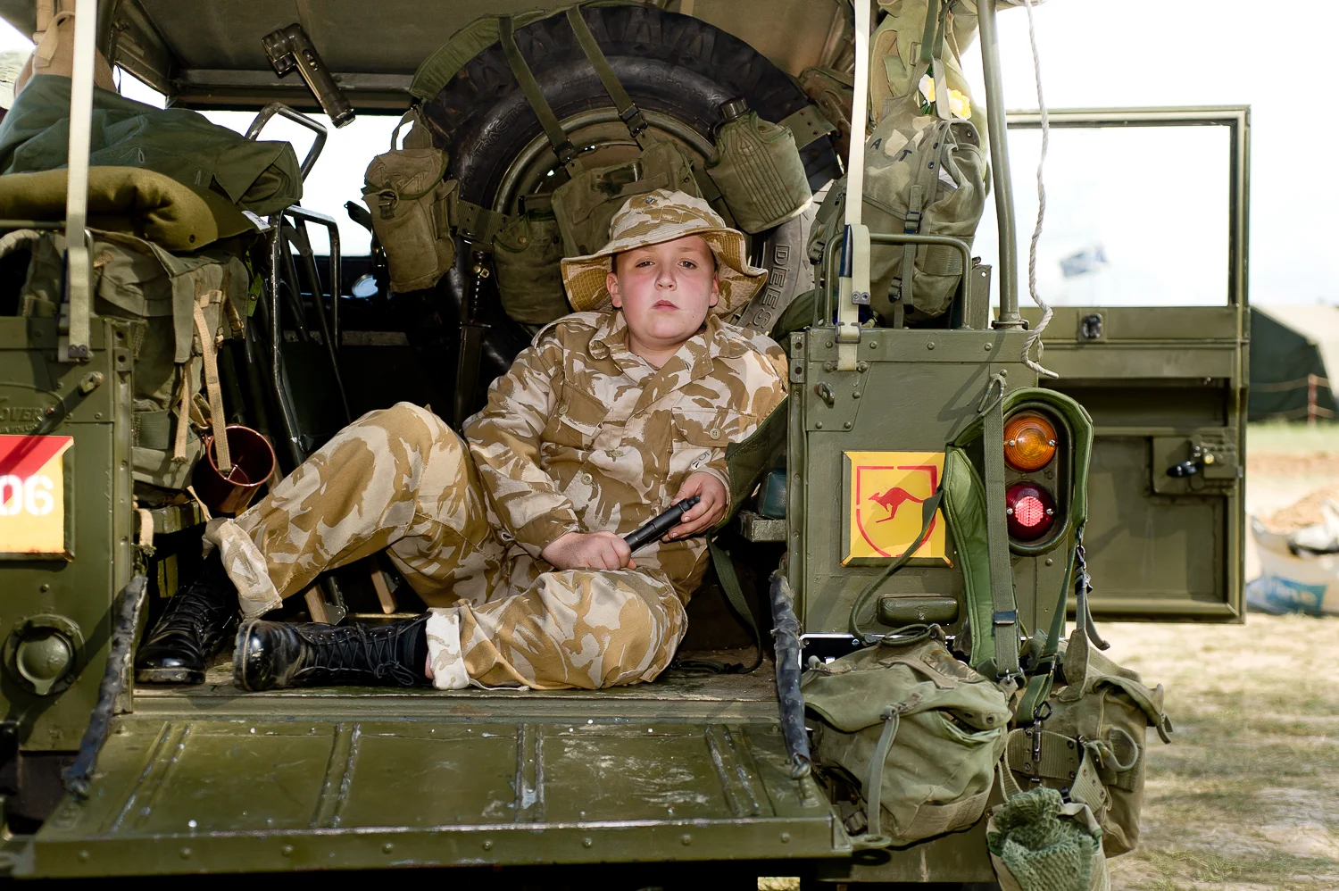 Boy in armoured vehicle, War and Peace show, Kent