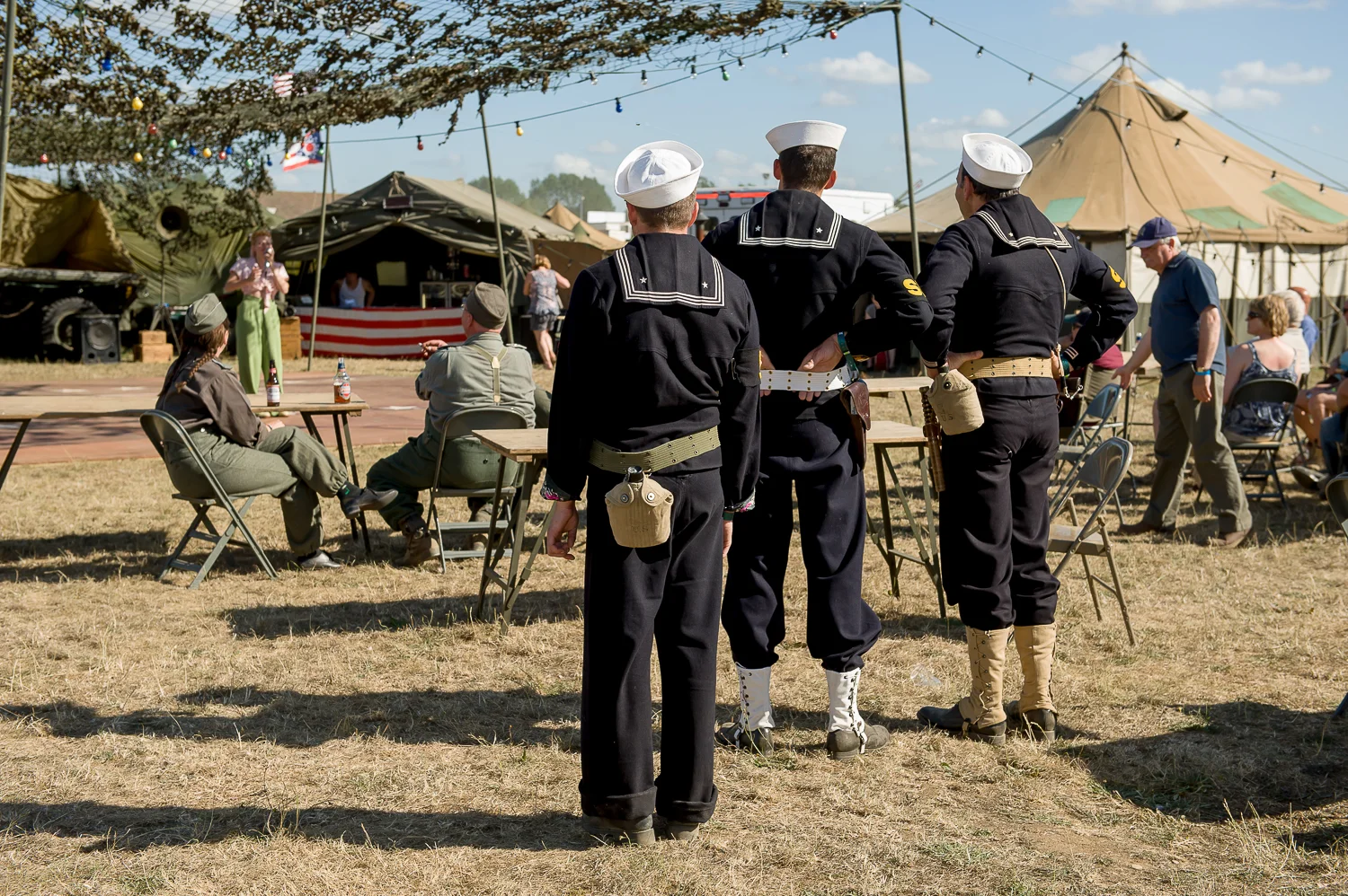 American navy re-enactors listening to singer at the War and peace show, kent