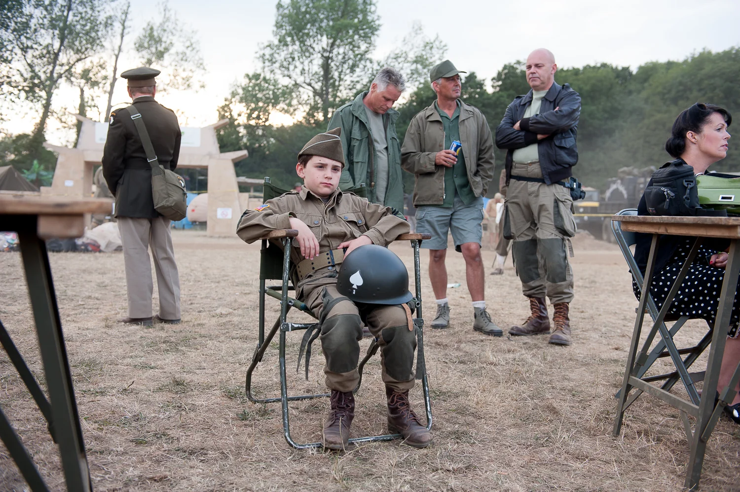 Young re-enactor watching period musical event at War and Peace Show, Kent