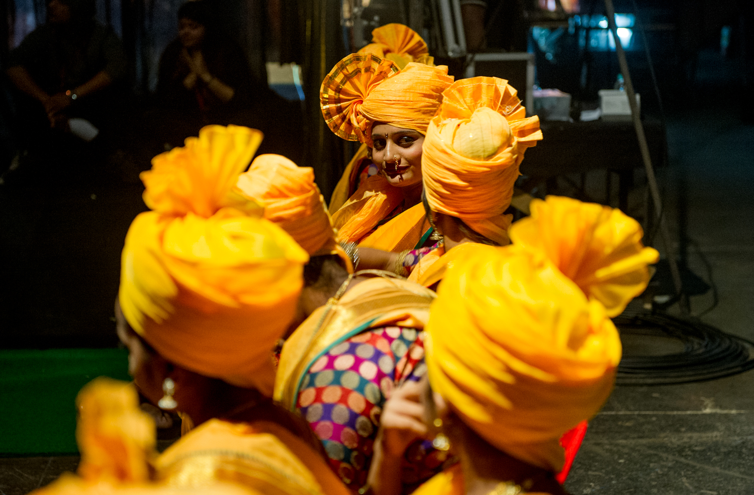  Traditional dance performers waiting to go on the Television stage of “Rising Star”, A popular T.V contest  show broadcasted nationwide. Film City, Mumbai, 2019 