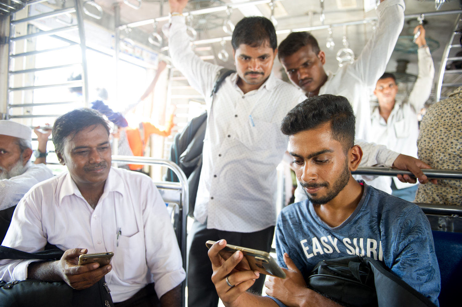  Watching cricket on a local train, Mumbai, 2019 