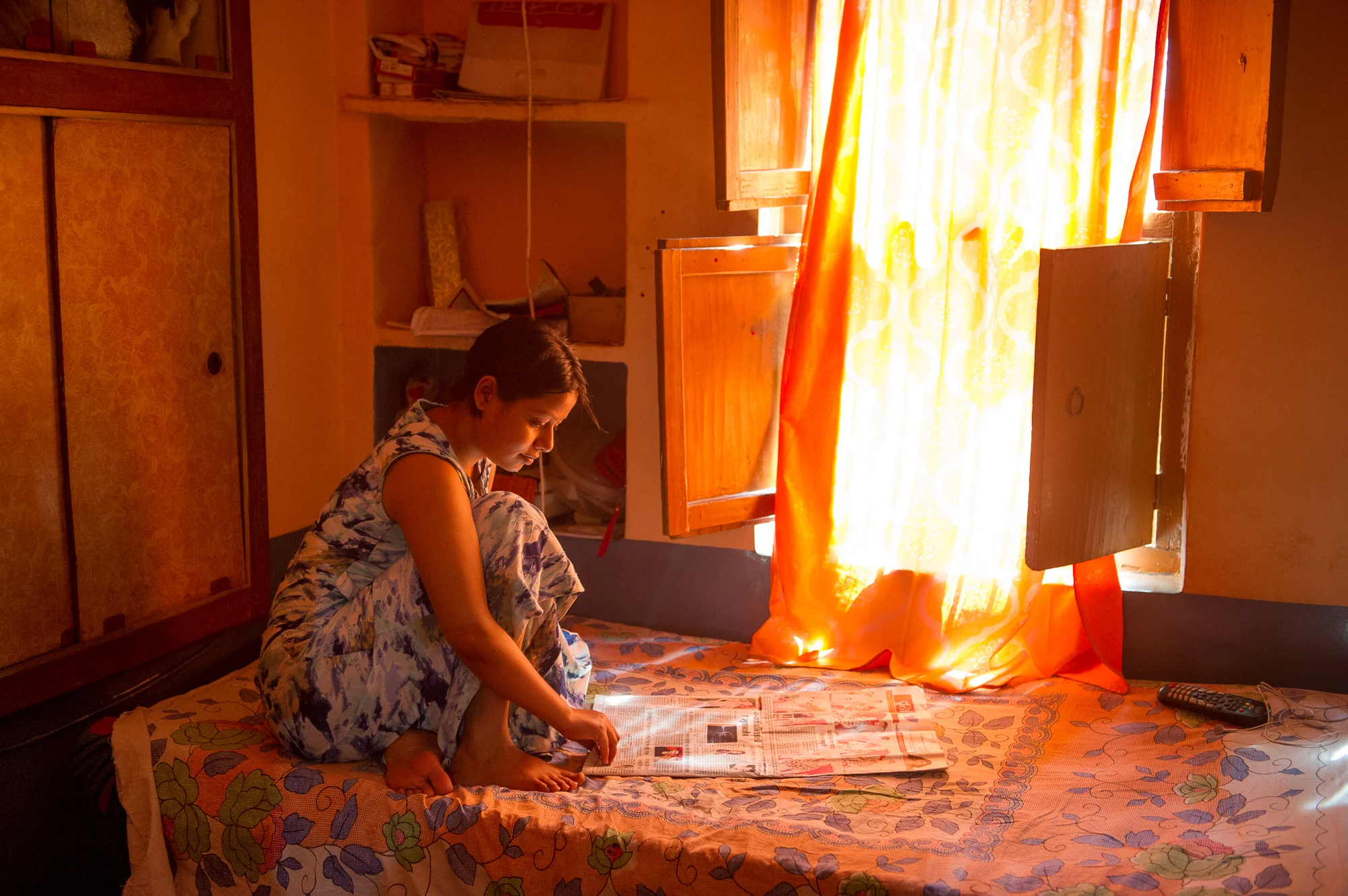 Guesthouse owner reading the newspaper, Varanasi, 2019