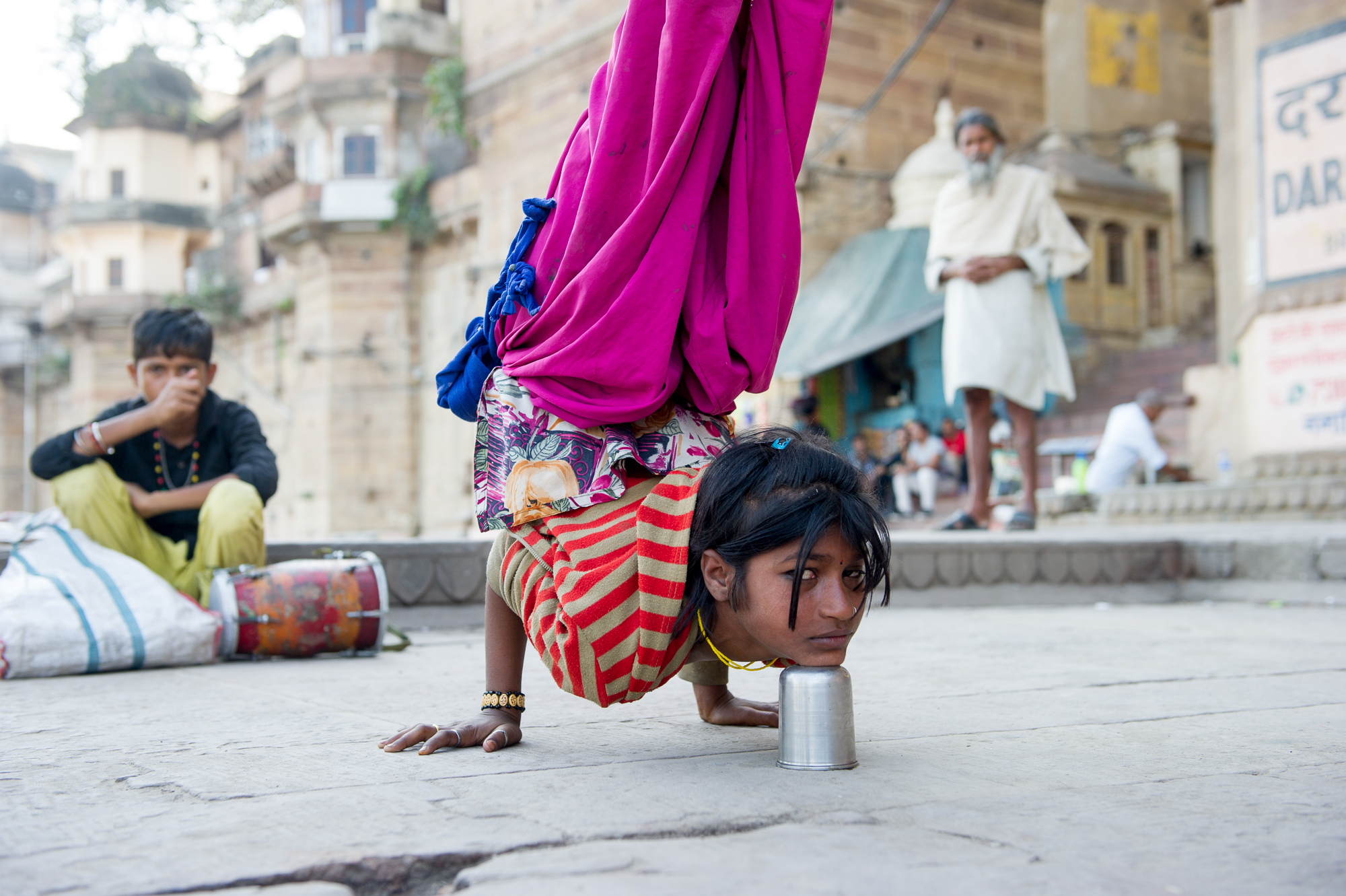  Young acrobat performing on the ghats of Varanasi, 2019 