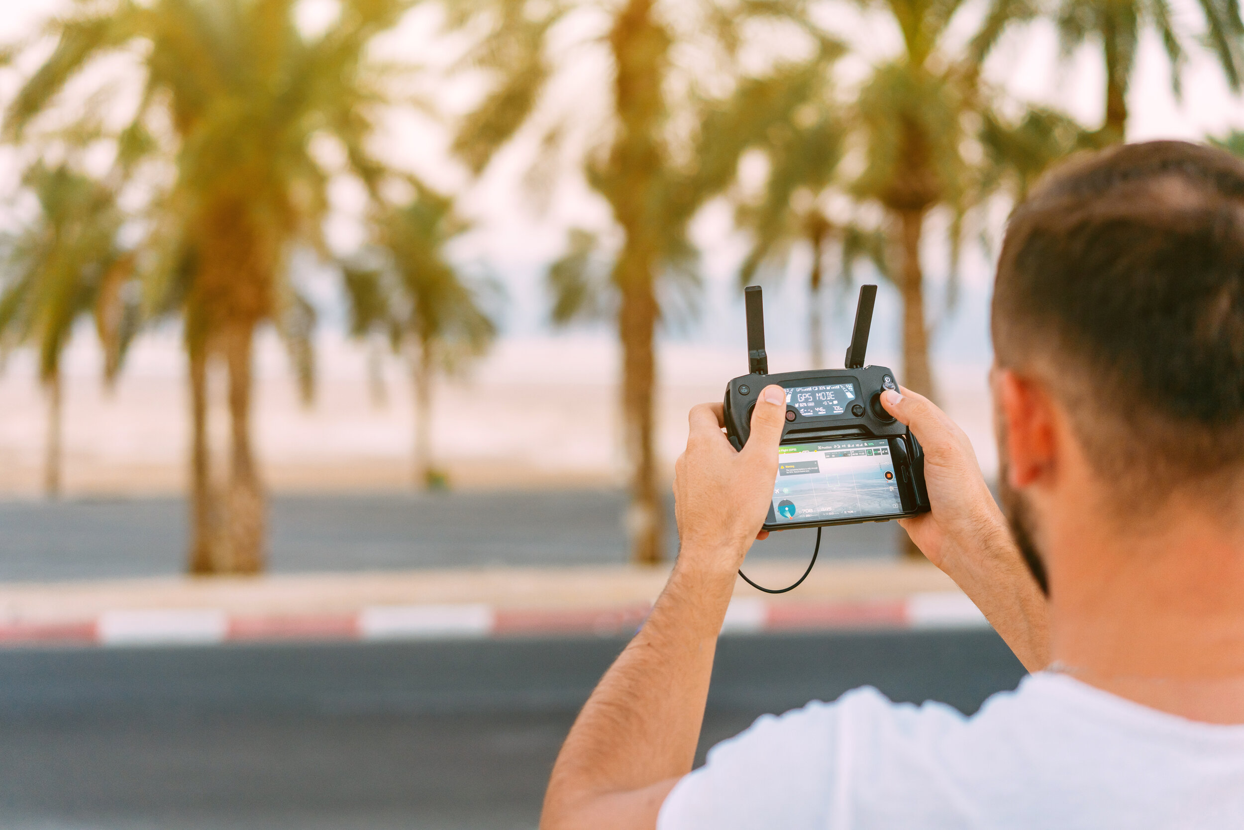 guy-controls-drone-with-remote-control-BEV3M2S.jpg