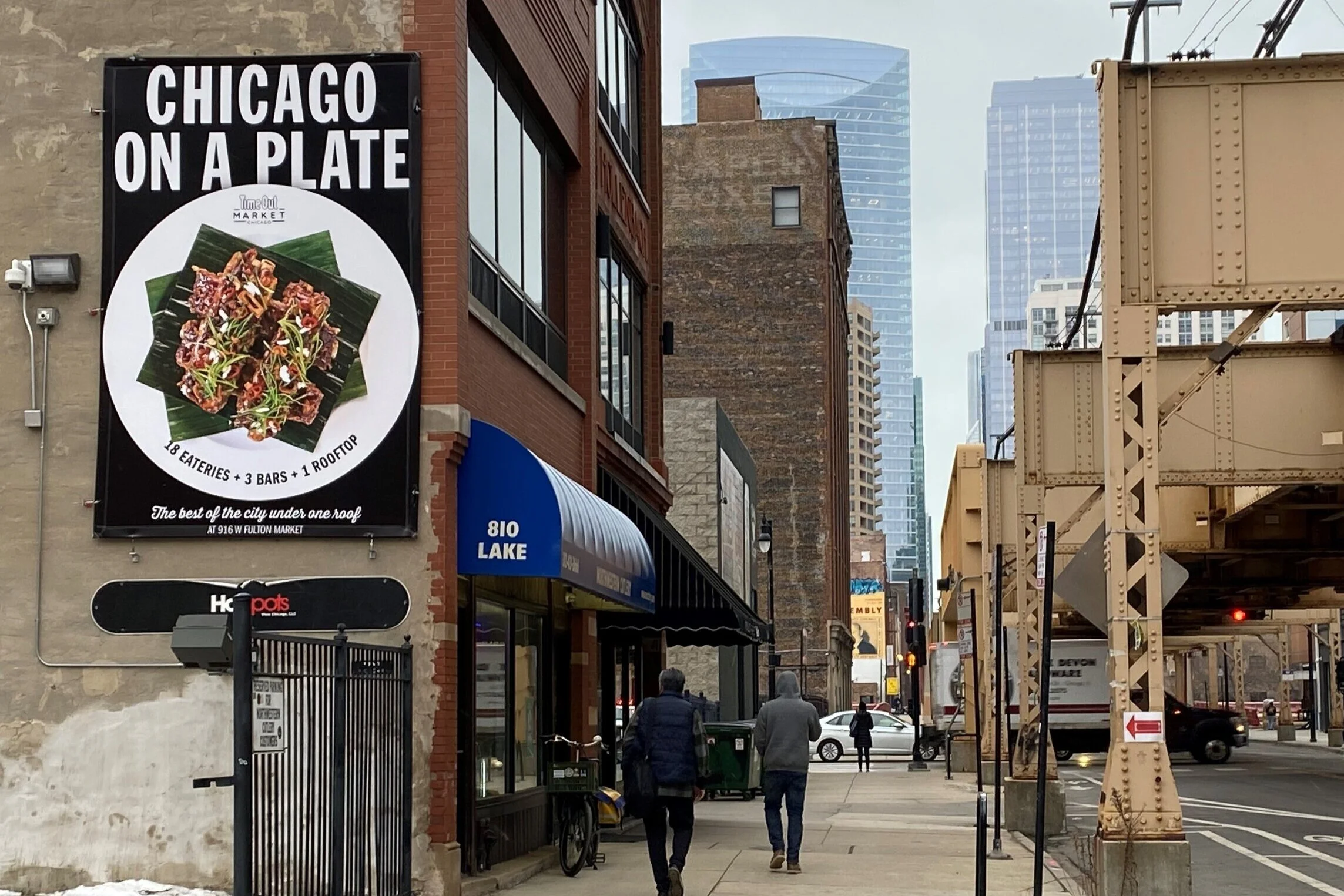 Small business outdoor advertising campaign for a local restaurant displayed in a busy Chicago neighborhood