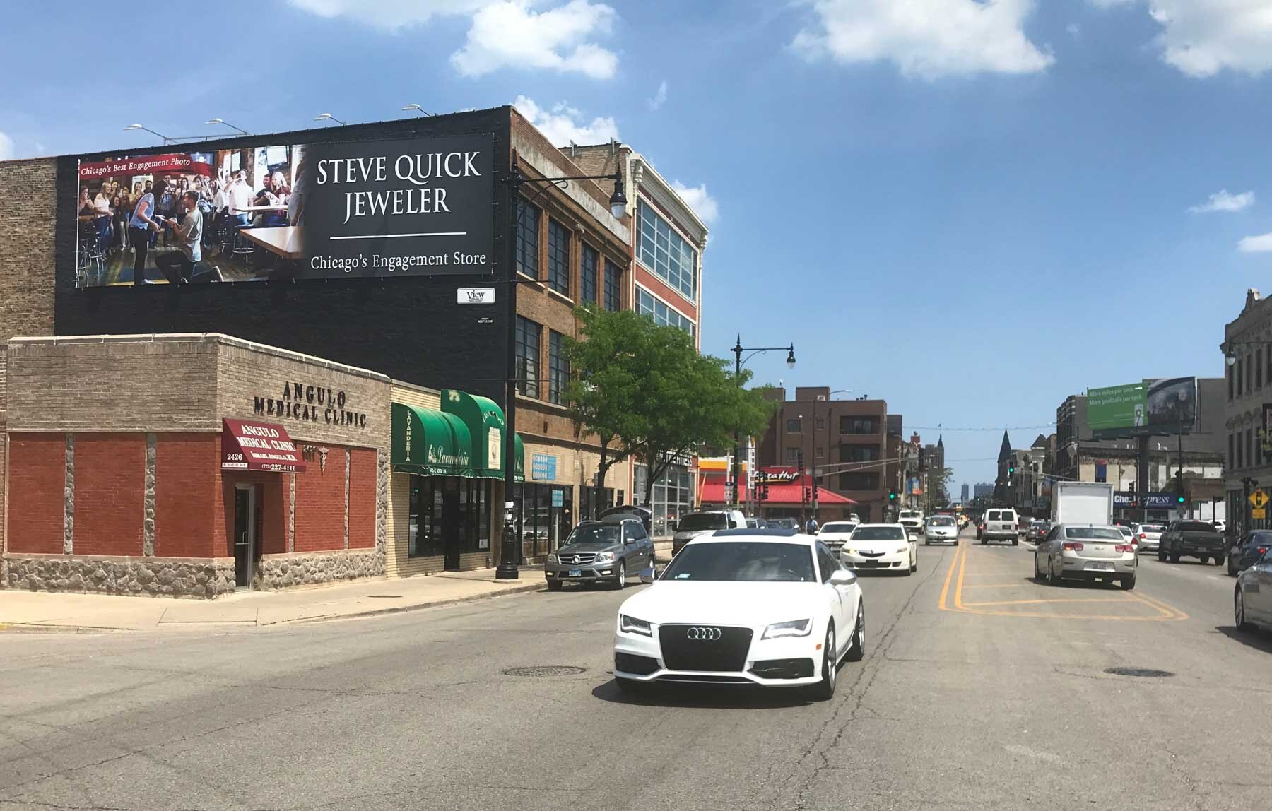 Steve Quick Jeweler wallscape advertising campaign displayed on a high-traffic Chicago building
