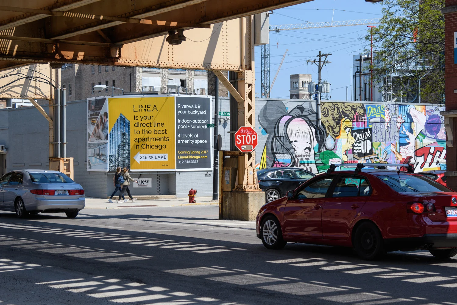 Linea luxury apartment wallscape ad in Chicago surrounded by street art and neighborhood traffic