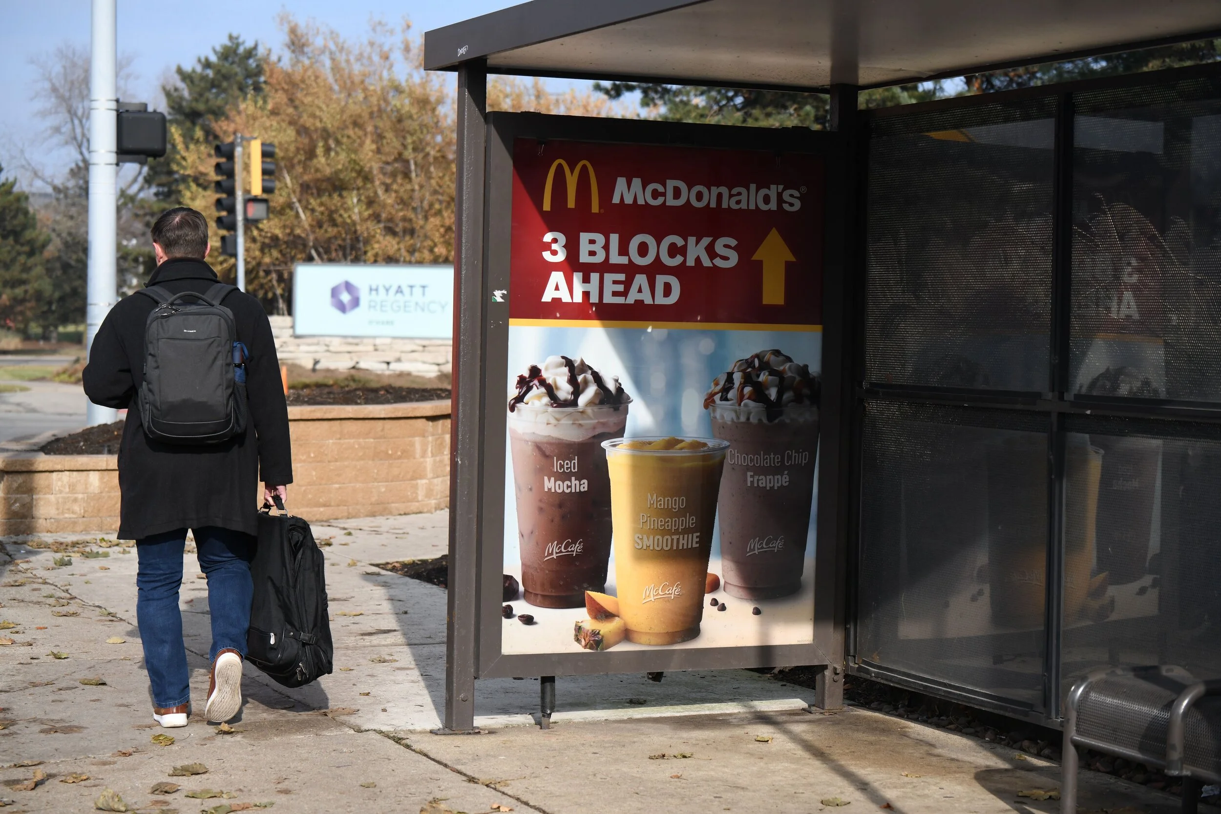 McDonald’s street furniture ad near Hyatt Regency O’Hare showing bus shelter advertising for local foot traffic