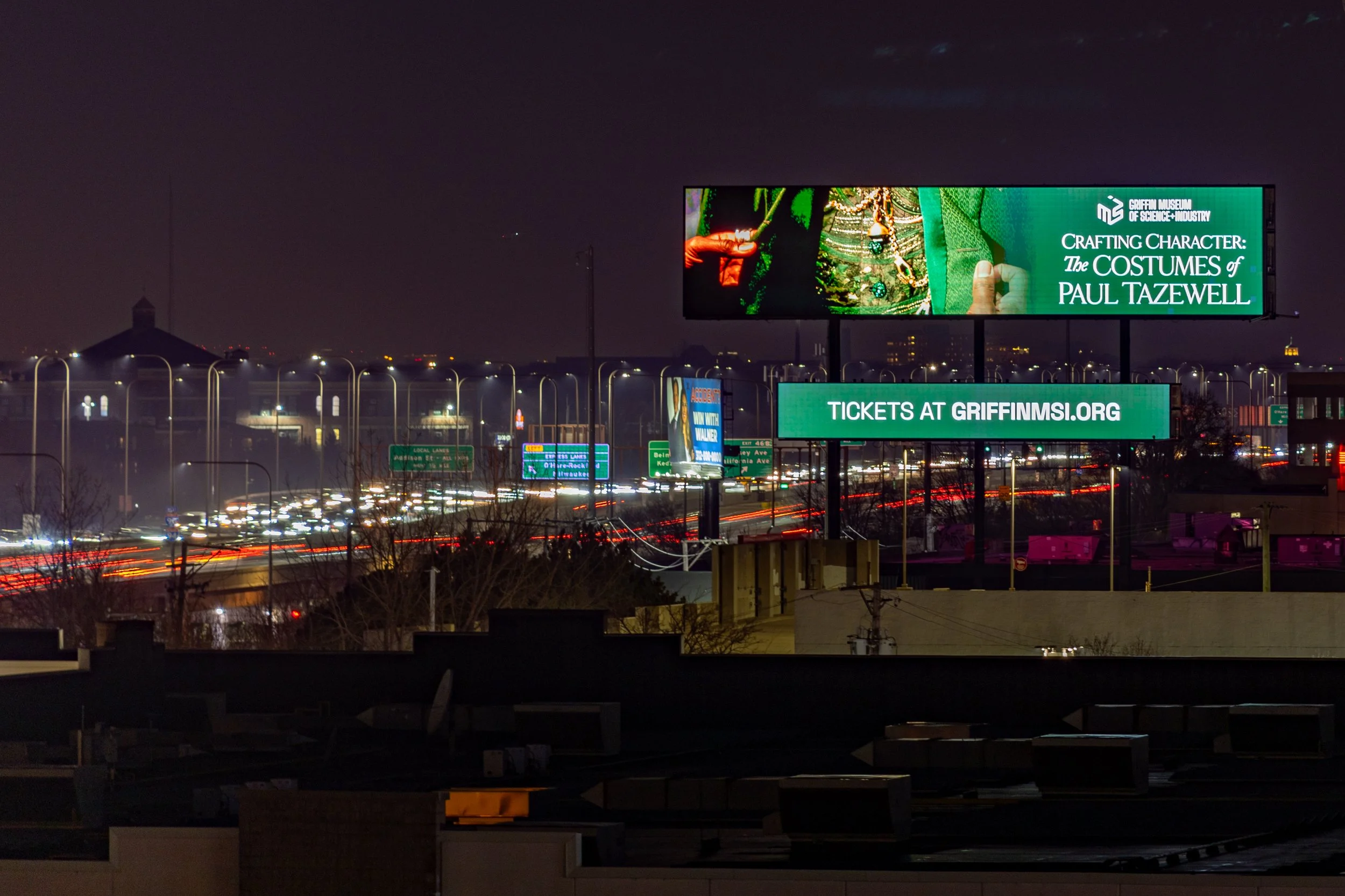 Digital billboard advertising for the Griffin Museum displayed at night along a high-traffic commuter route