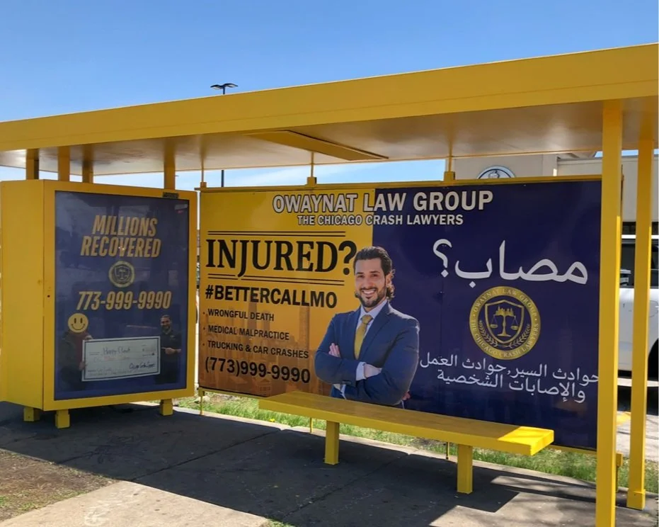Chicago-area bus stop shelter domination for Owaynat Law Group with bold legal advertising and Arabic messaging