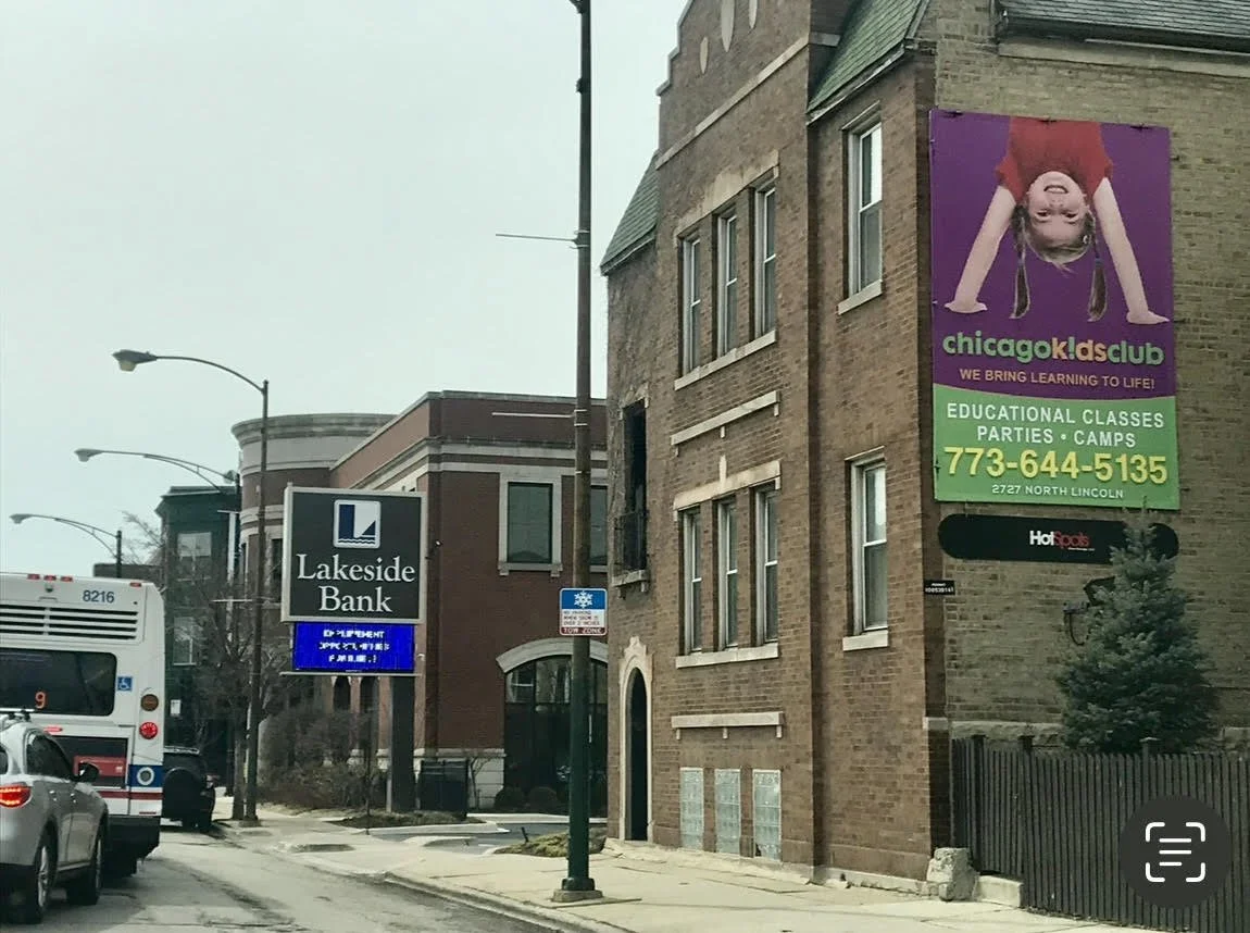 Childcare billboard advertising for Chicago Kids Club promoting educational classes, parties, and camps