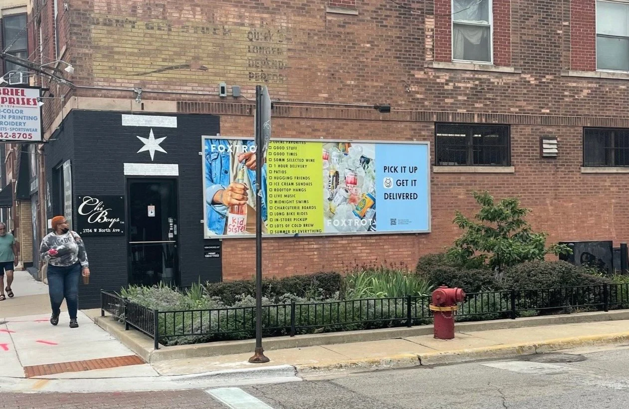 Retail wallscape advertising campaign reaching drivers and pedestrians with large-format outdoor advertising