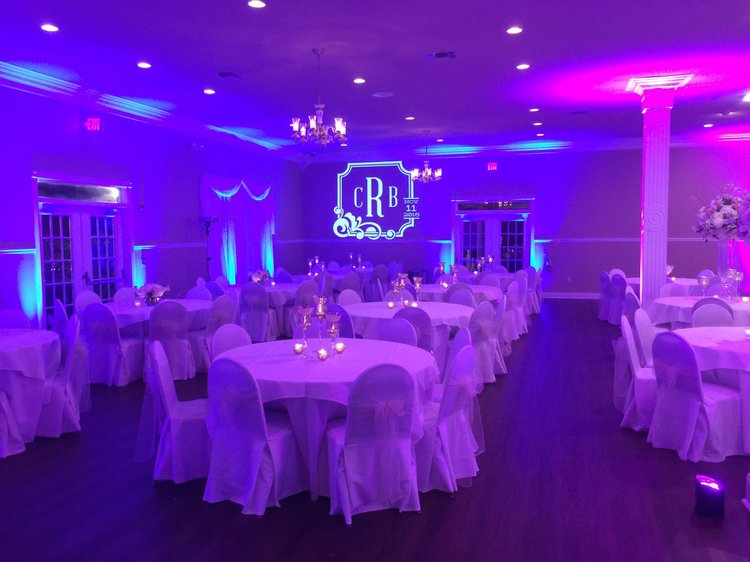 Purple event uplighting and a custom monogram by Rock-It Productions
