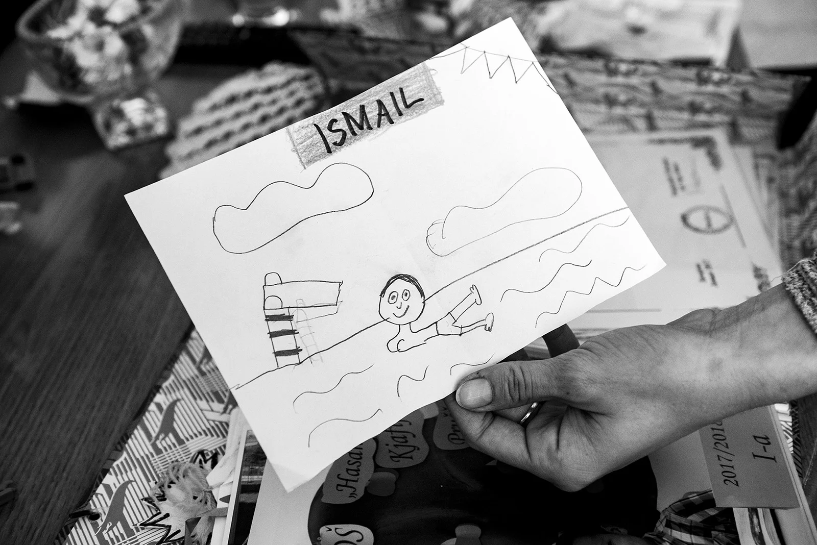 Elmina shows one of the drawings that Ismail got from a friend at school.