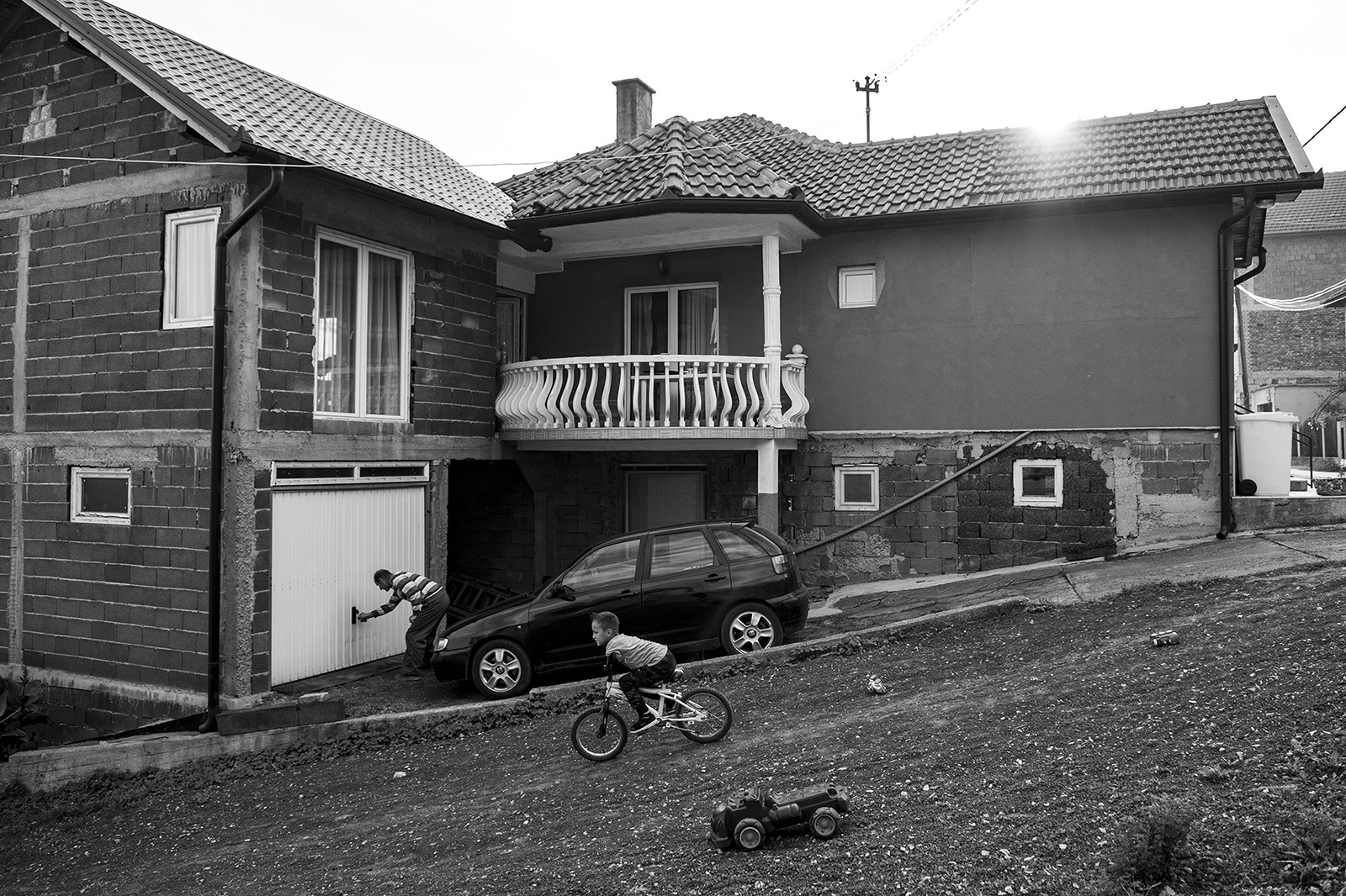 Ismail rides a bicycle down the hill toward his home, he says “driving on the road quickly gets bored.”