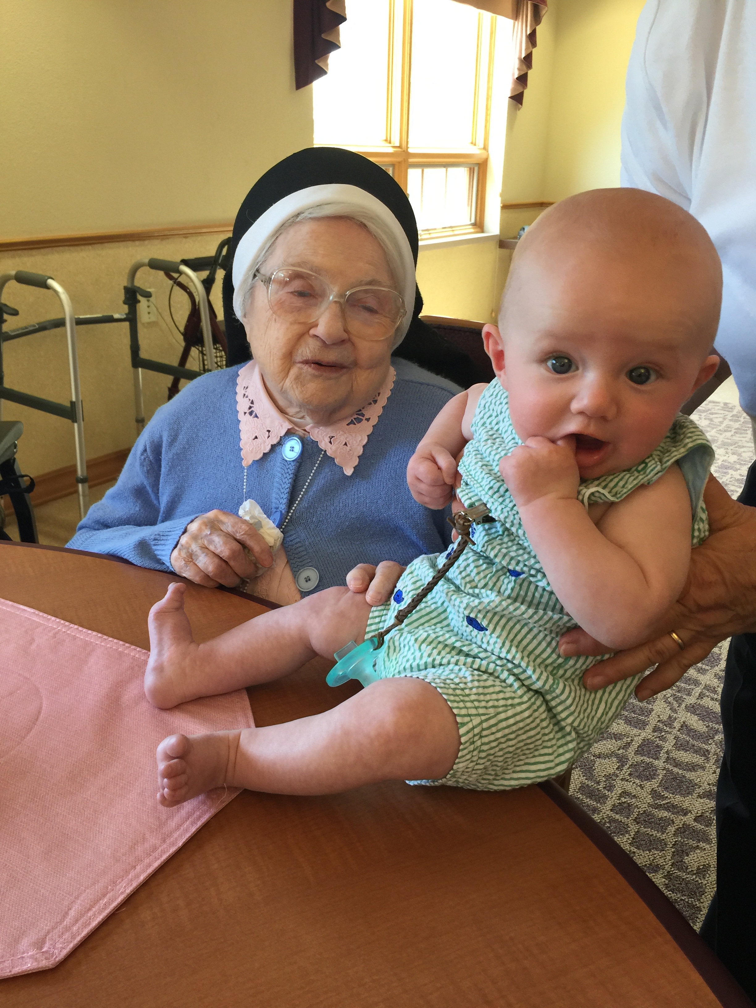 This is Sister Francis Gabriel Lenihan with Dillon - she is (only) 105 years old and is blind but incredibly sharp. She got to know Dillon by feeling his feet and legs and said he is very cute (again...dead right!).