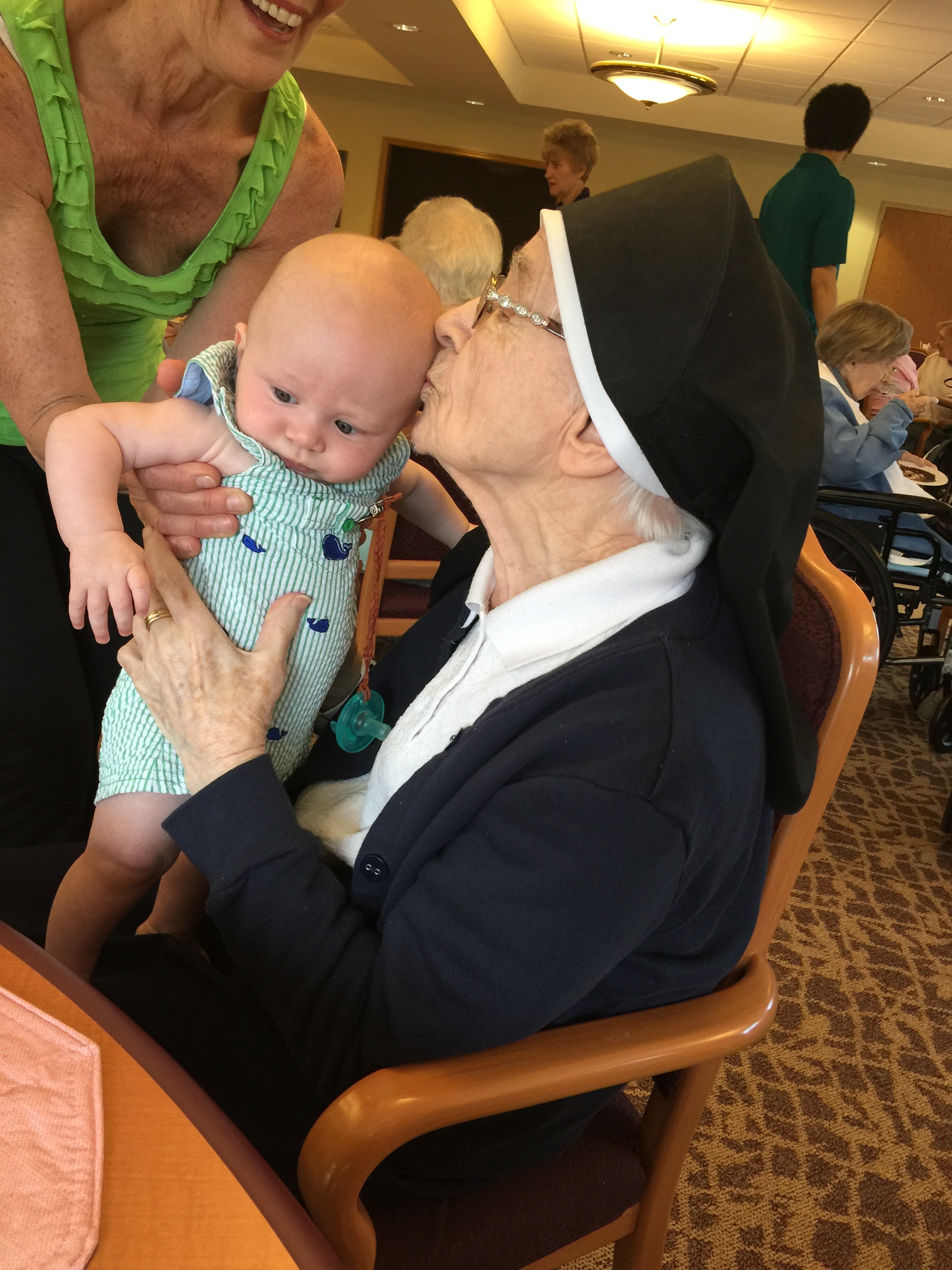 This is Sr. Ave Maria Foley introducing herself to baby Henry. Baby Hank is normally always worried about something, but he seemed very comfortable and stress-free in her presence.