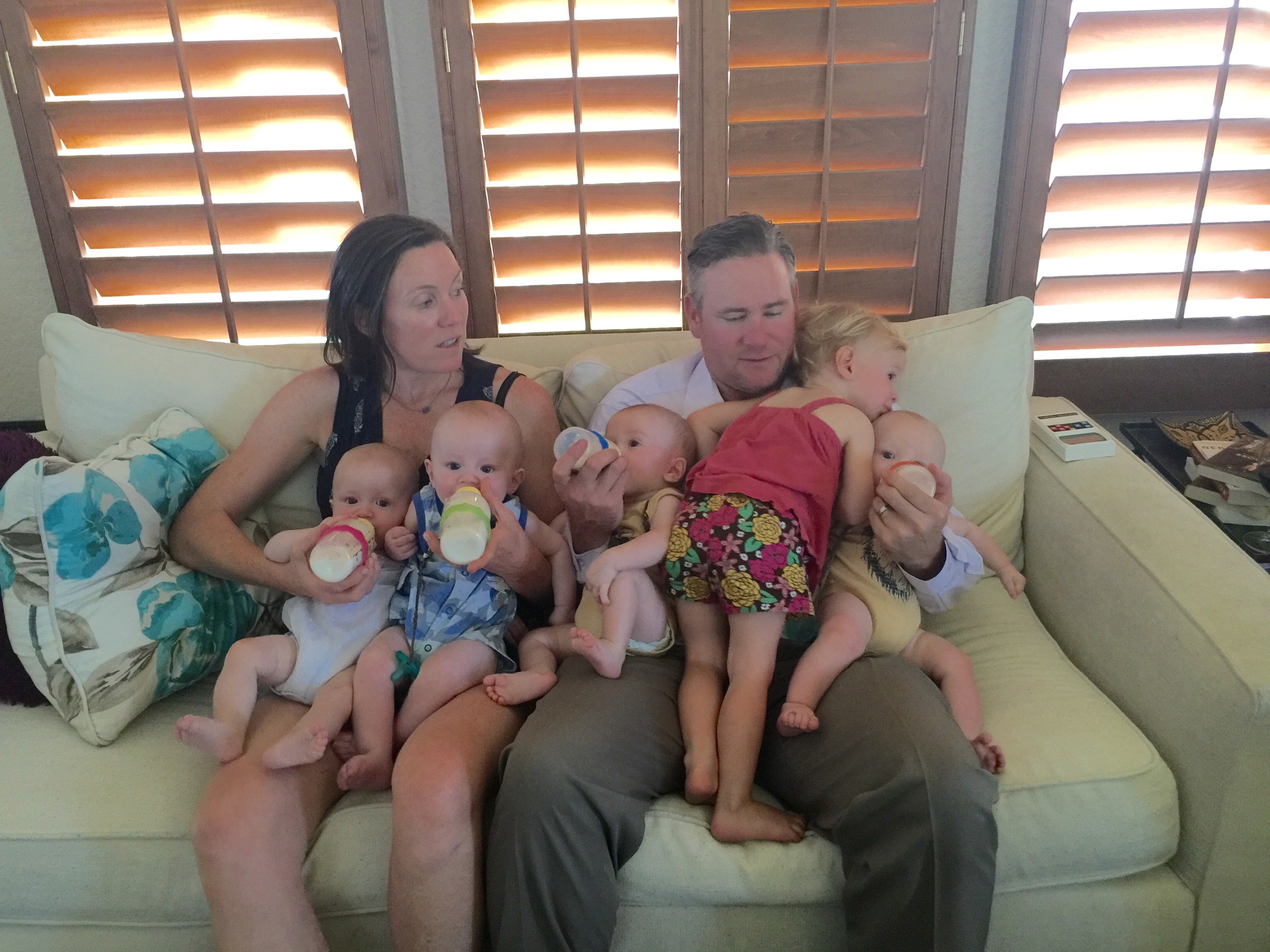 Morning bottles with the Moll Doll (kind of) helping