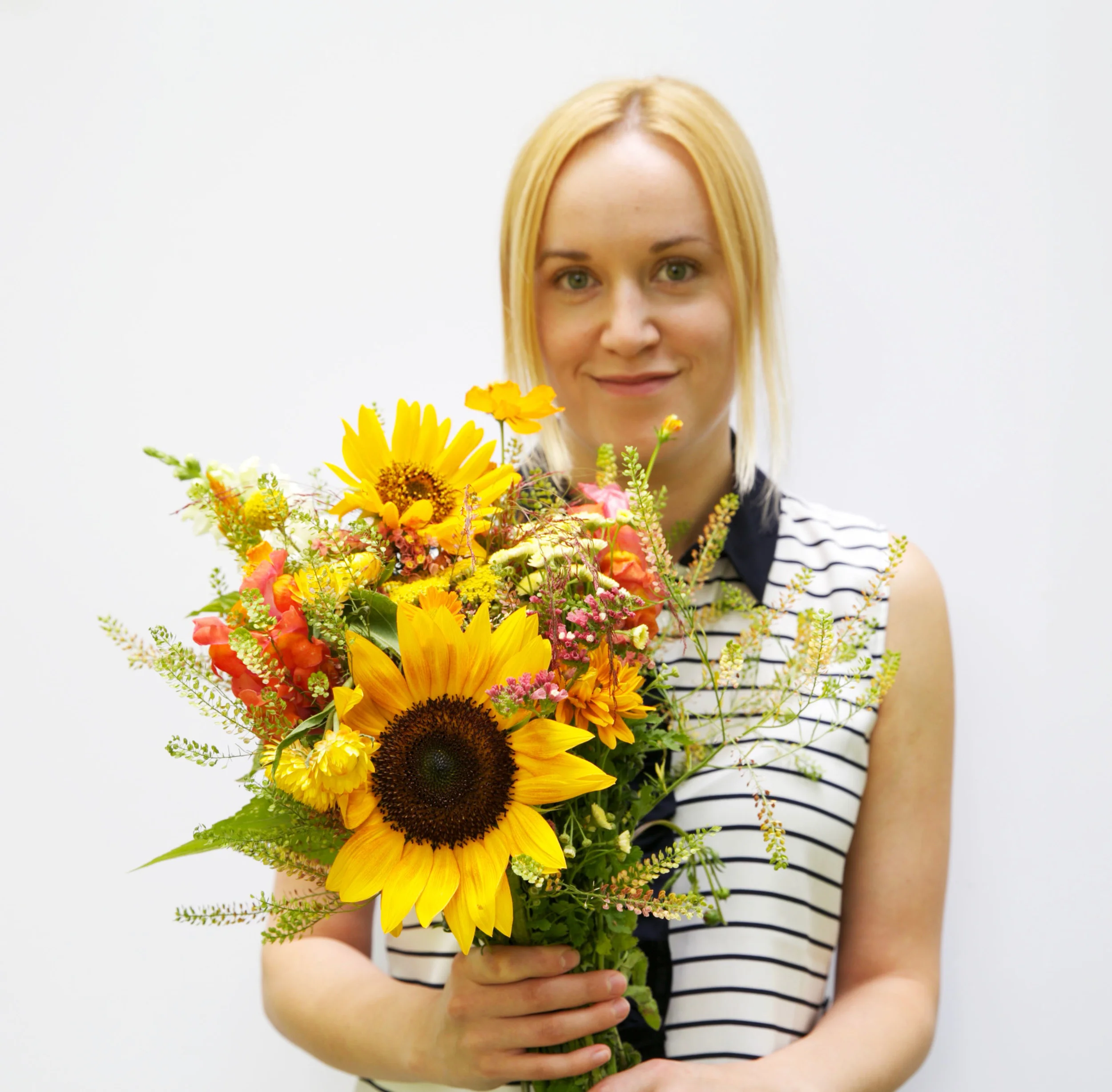 We asked our summer intern, Marta, to pose with the flowers since she matched them :)