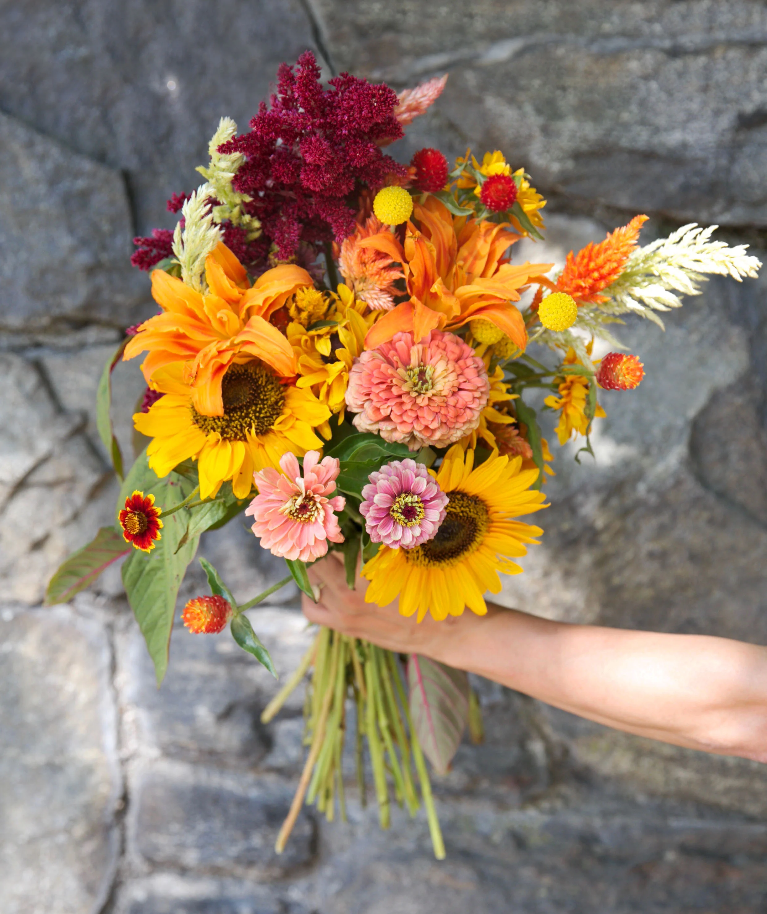 Loved the peaches and oranges in this bouquet (found a great stone wall as backdrop)